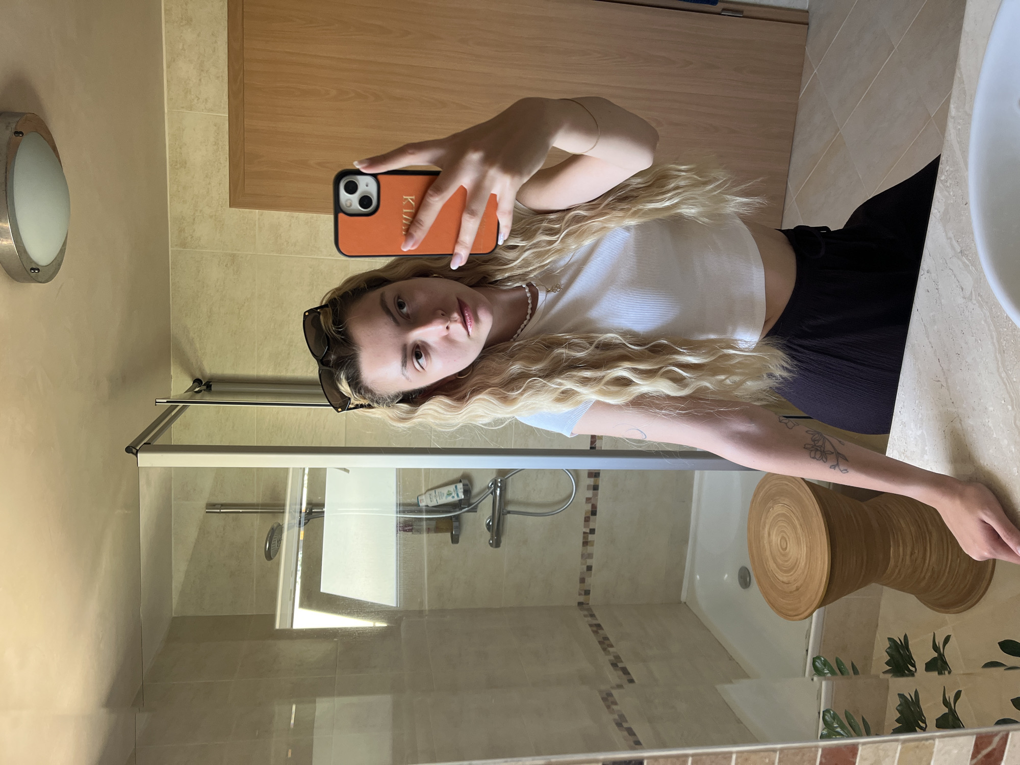 Woman Takes Multiple Bathroom Mirror Selfies in Seven Minutes