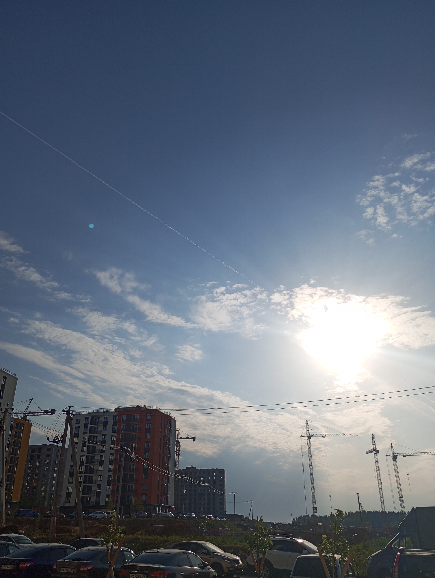 Construction activity and blooming flowers observed in Pervomaysky, Russia