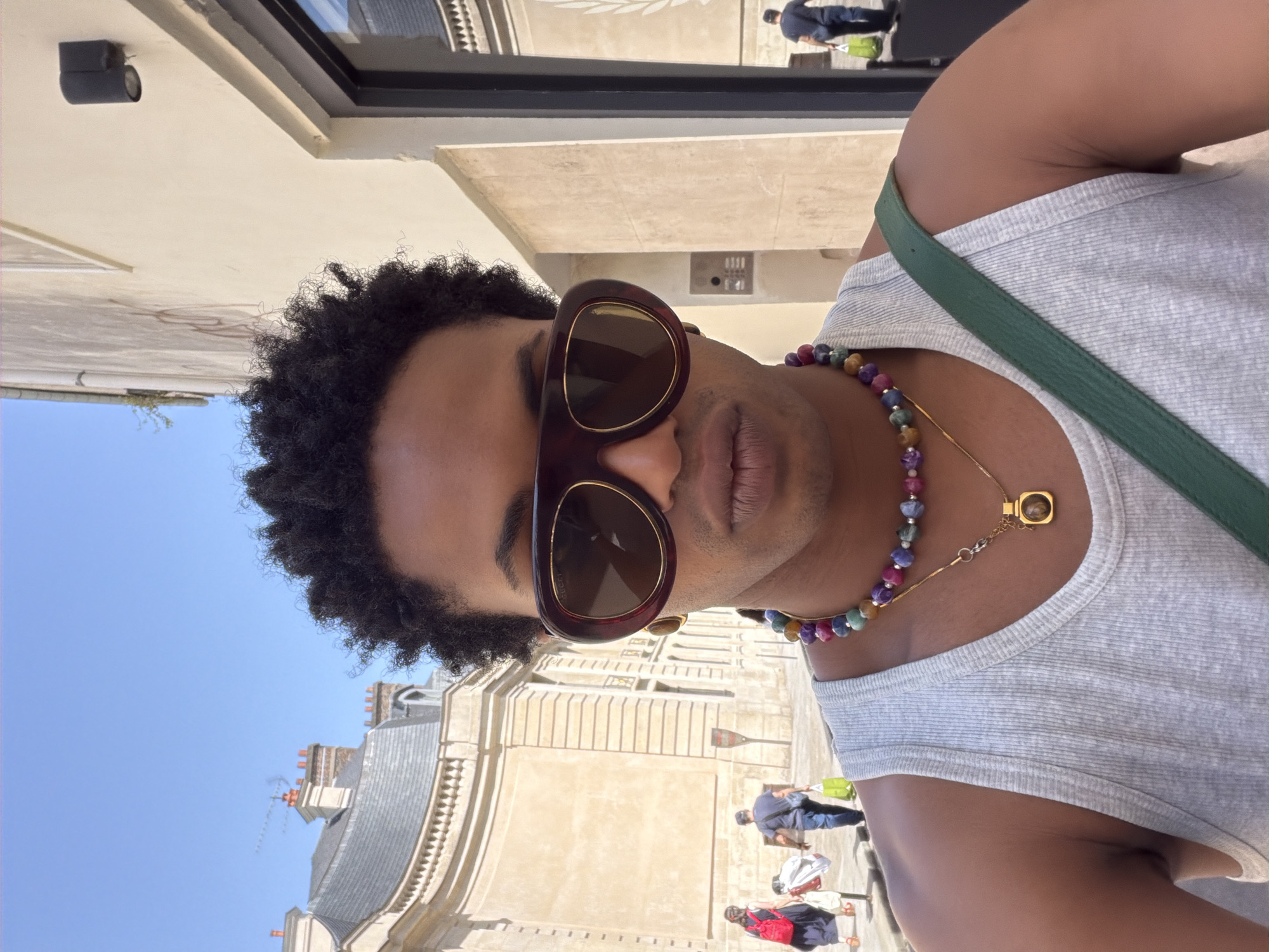Person photographs self near Supreme shopping bags in Paris