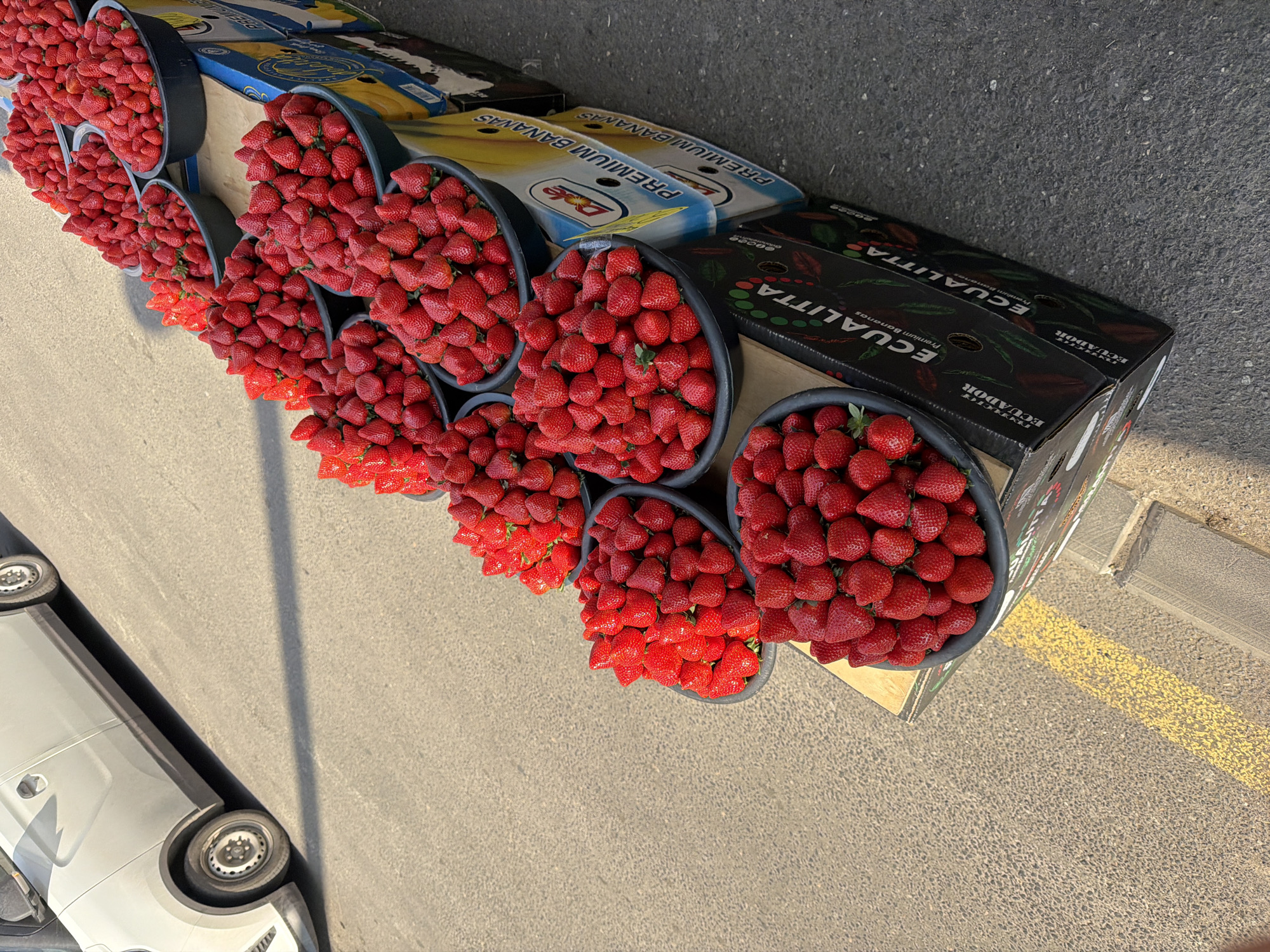 Fresh strawberries displayed at roadside market stall in Yerevan
