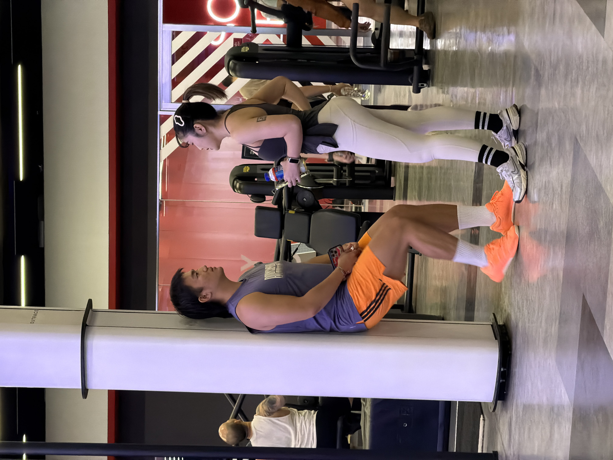 Gym session underway at a neon-lit fitness space in Nong Pa Khrang