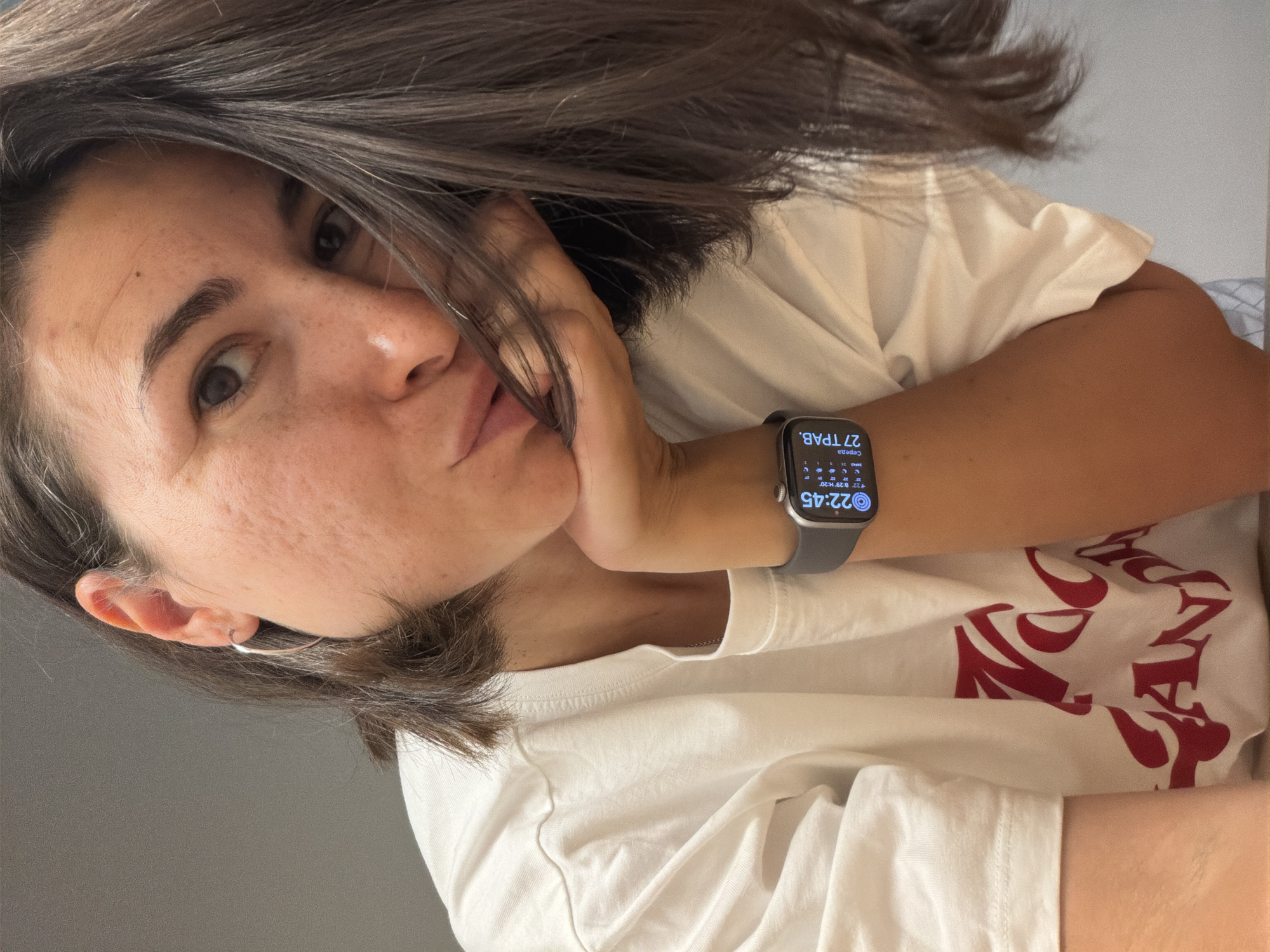Woman takes multiple selfies indoors in Budva, Montenegro