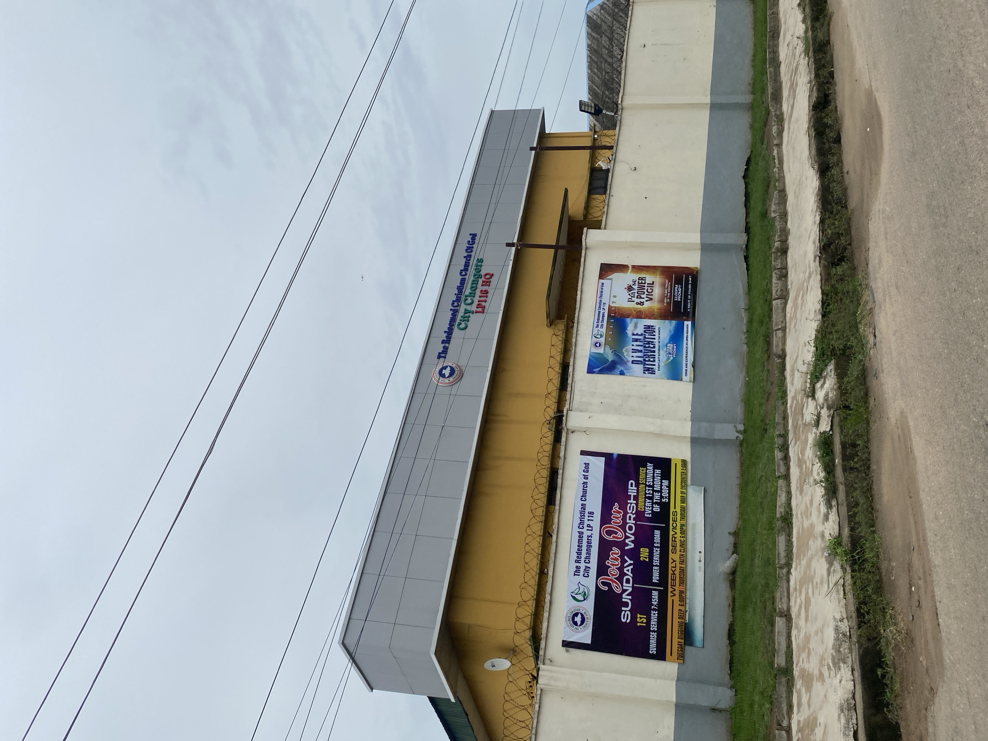 Lagos street scenes show church, mixed buildings on worn road