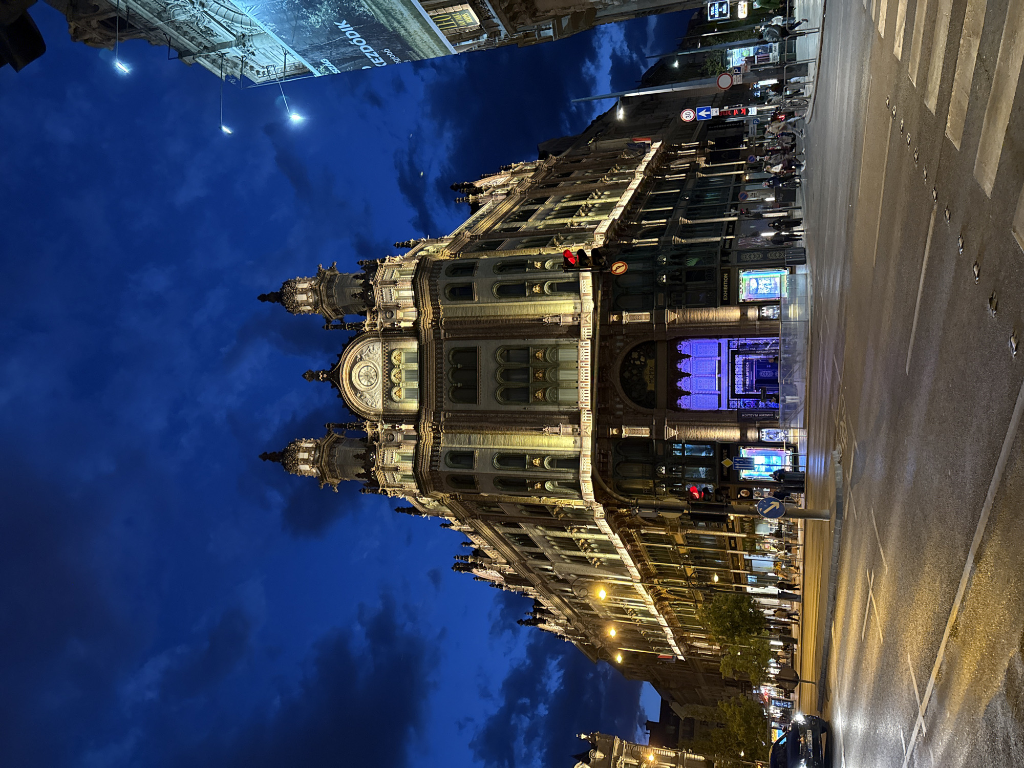 Historic ornate building documented at Budapest intersection during twilight
