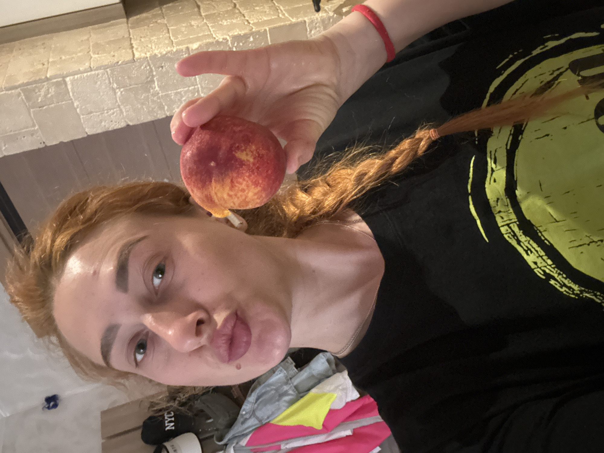 Woman eating peach captured in Budva residence