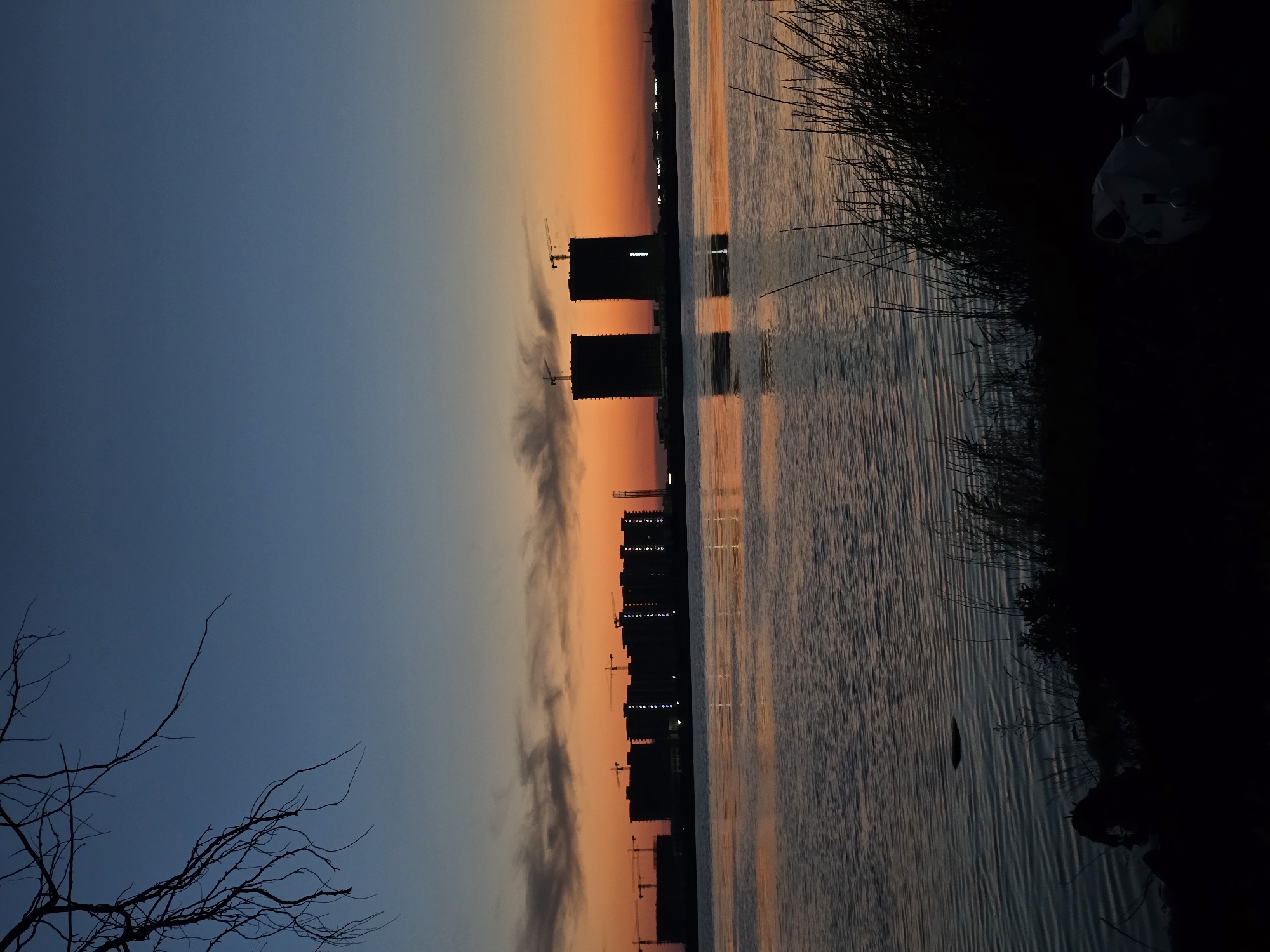 Sunset over Yevpatoriya waterfront, small fire in the reeds