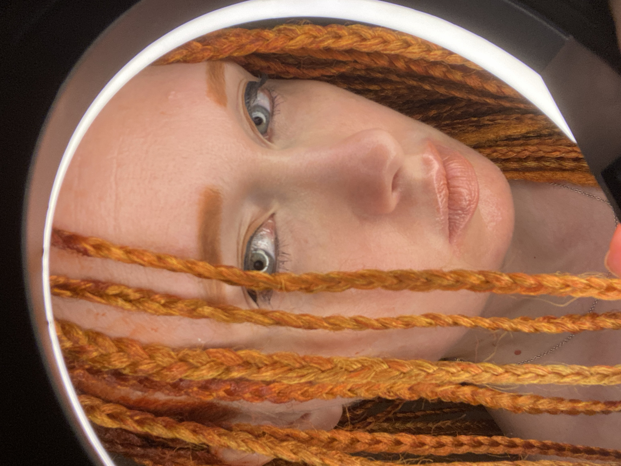 Woman conducts indoor portrait session with lighting equipment in Sochi
