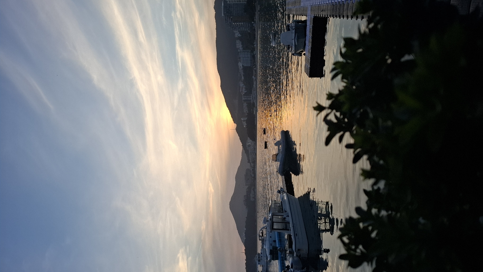 Evening fishing activities observed at Montenegro waterfront during sunset