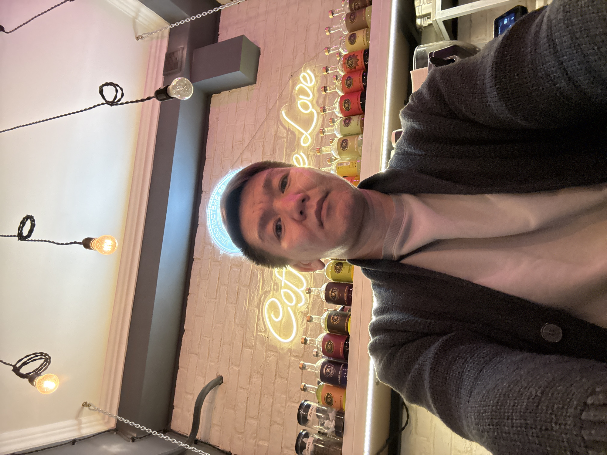 Person takes selfie at coffee shop in Khimki, Russia