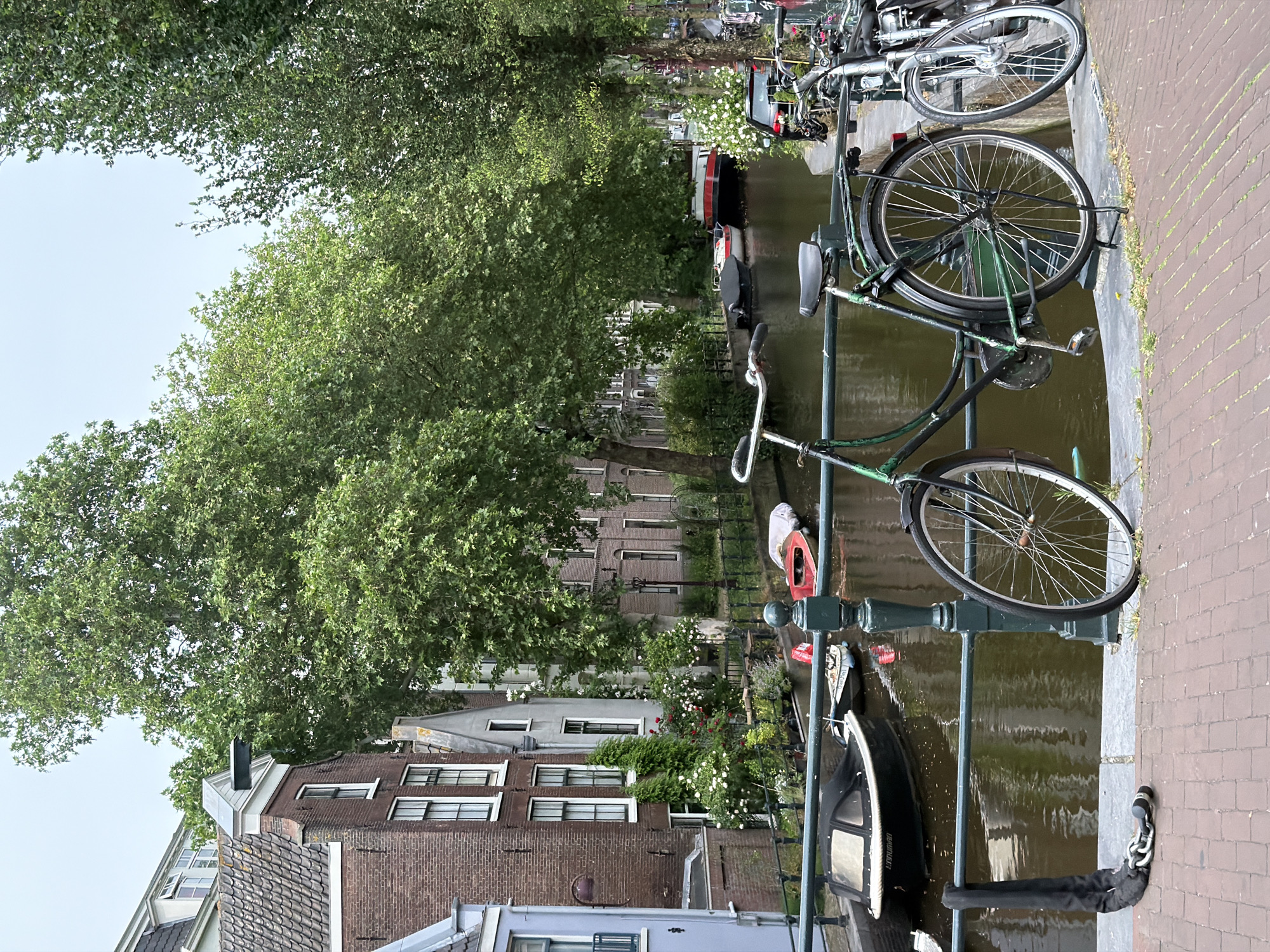 Amsterdam canal and cafe scenes captured during afternoon