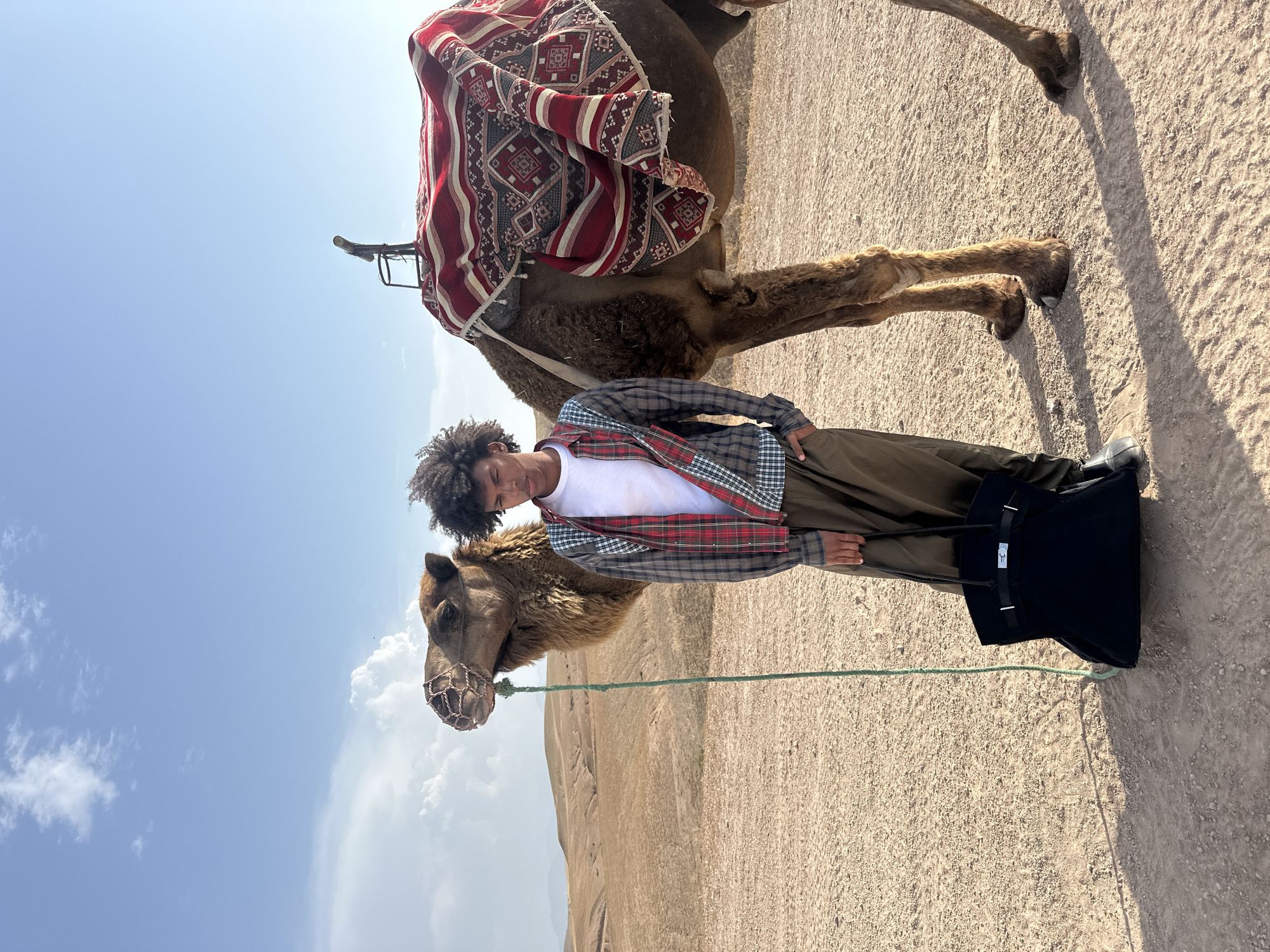Tourists enjoy camel tour experience in Sidi Badhaj Morocco