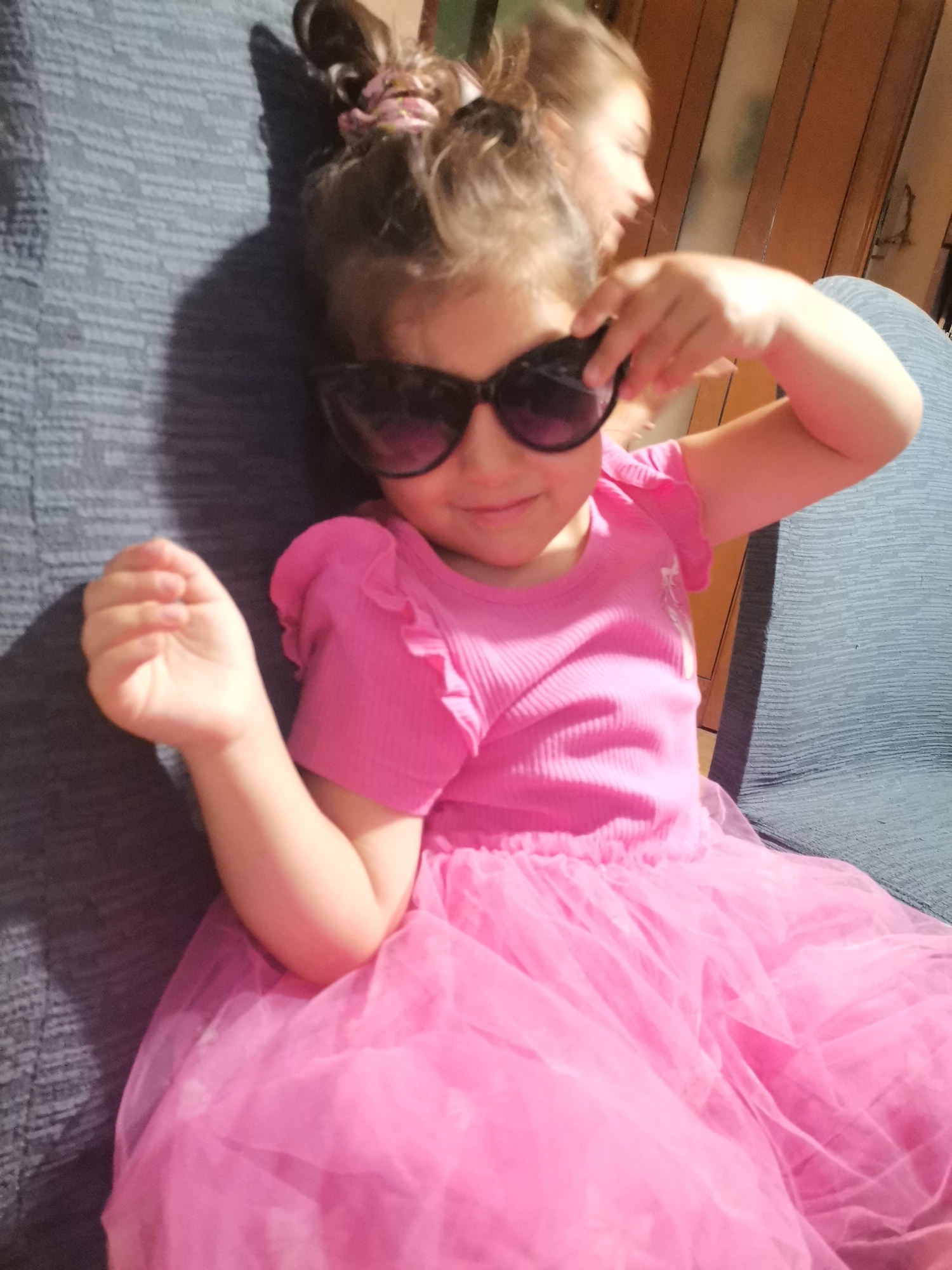 Pink outfits and oversized sunglasses at home in Bulgaria