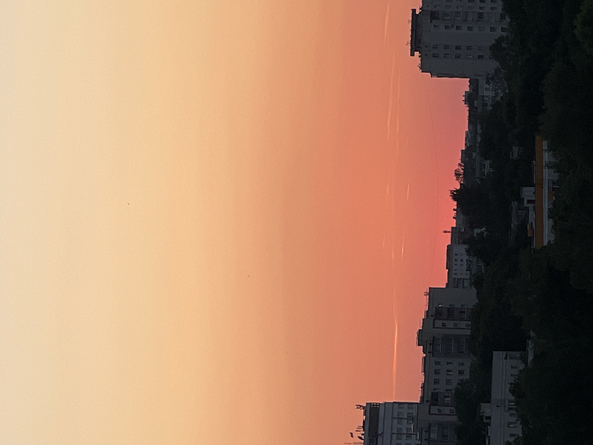 Minsk skyline at dusk, city and forest in frame