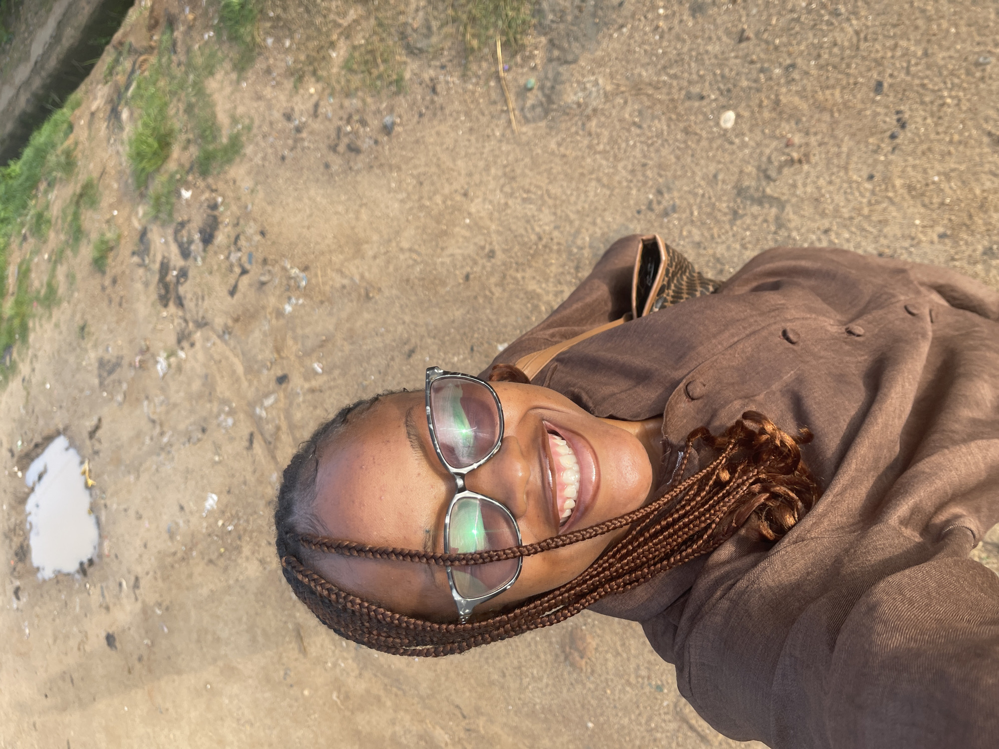 Morning street life on a dirt road in Rafin Par, Nigeria