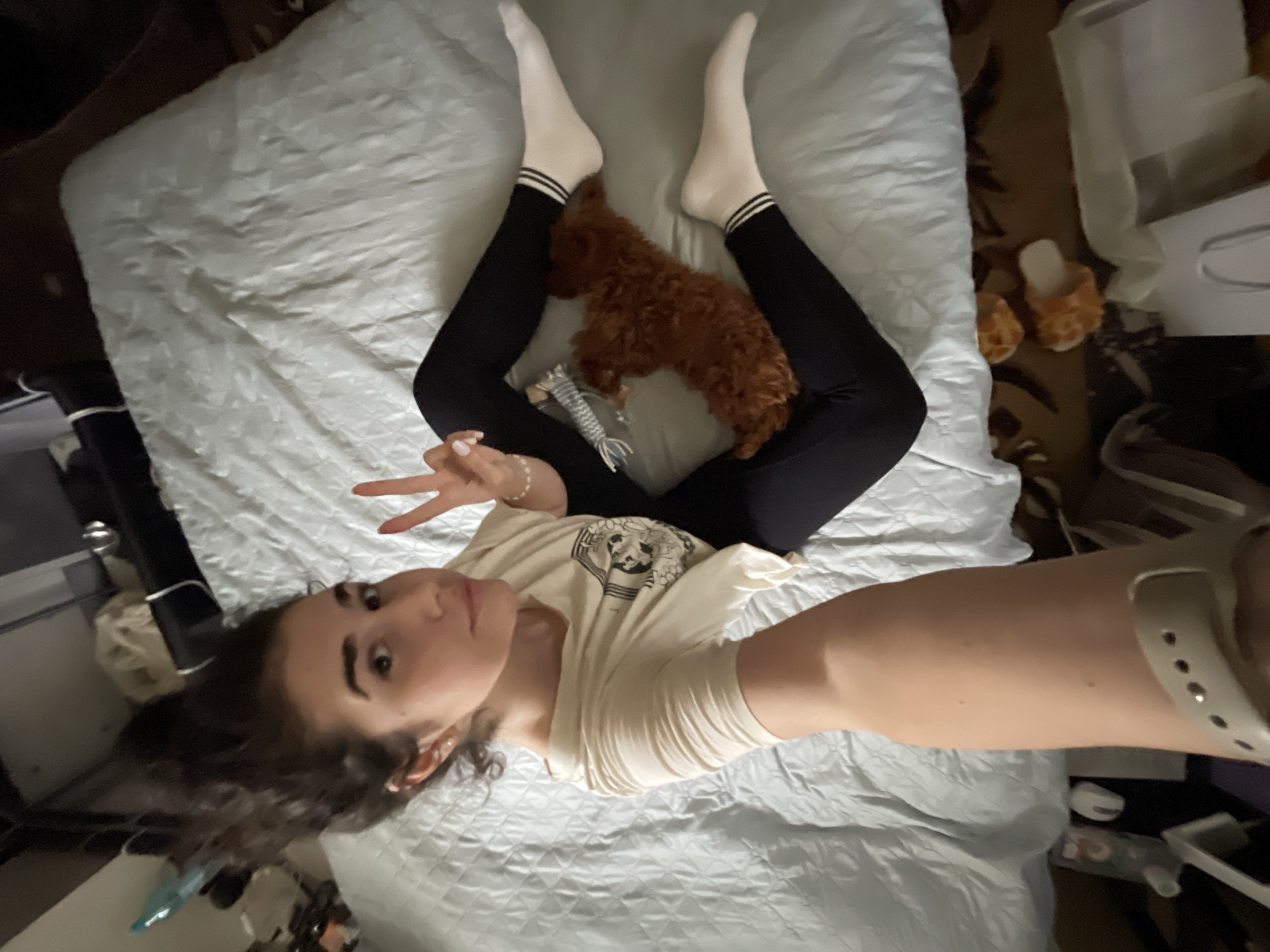 Woman takes afternoon selfies with sleeping dog in Sofia