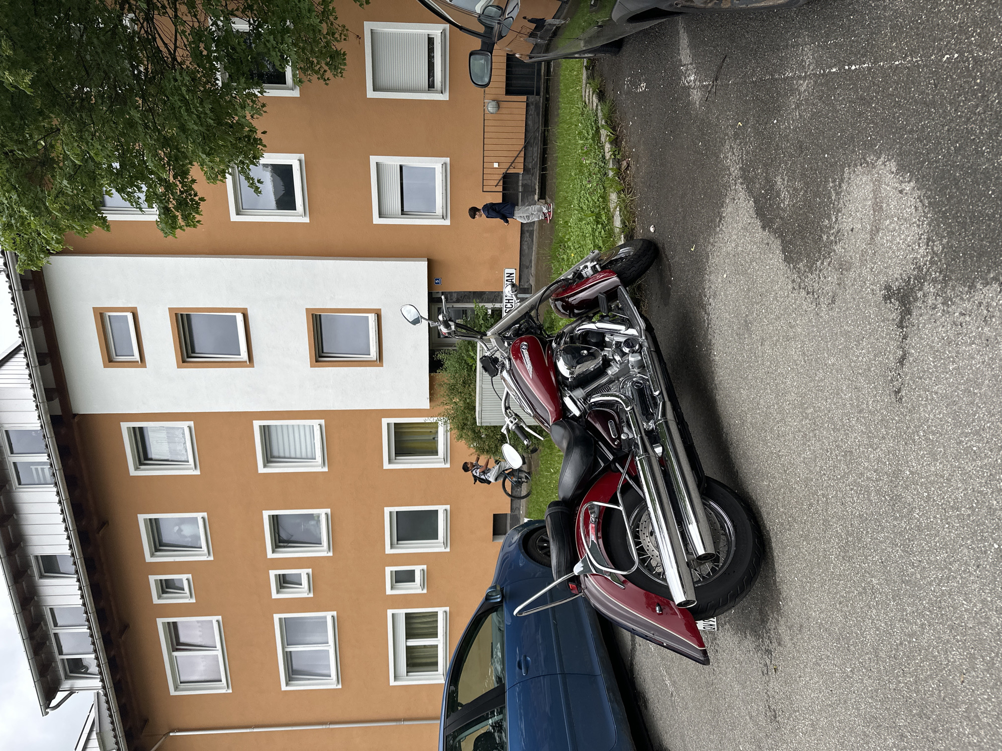 Young man performs split jump on Garmisch-Partenkirchen street
