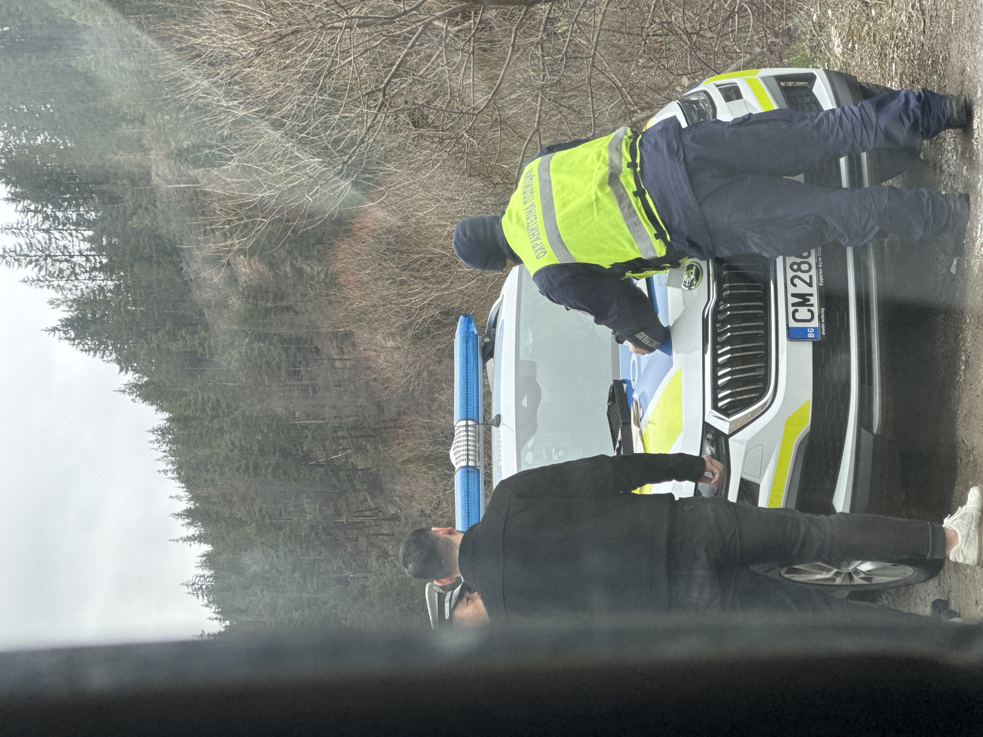 Police officers conduct routine vehicle inspection in Chepelare, Bulgaria