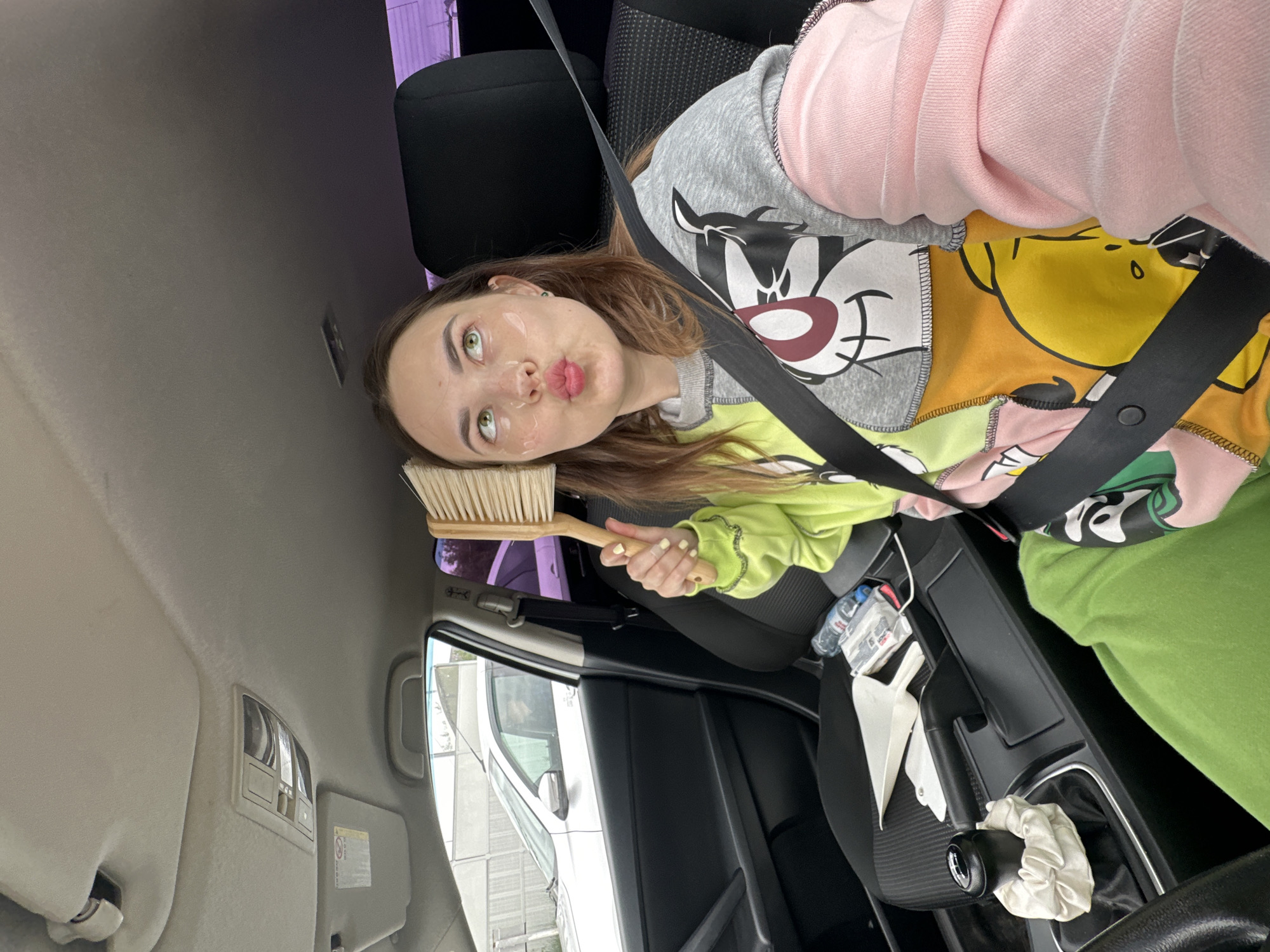 Woman takes early morning car selfies in Perm