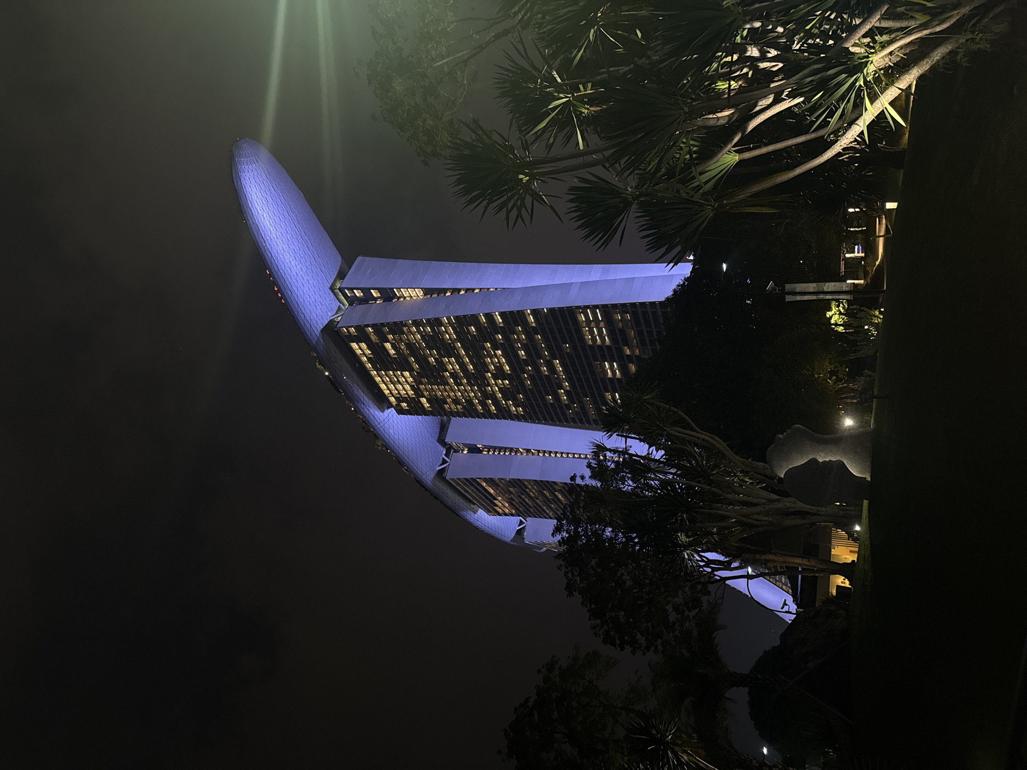 ArtScience Museum glows blue in Singapore nighttime scene