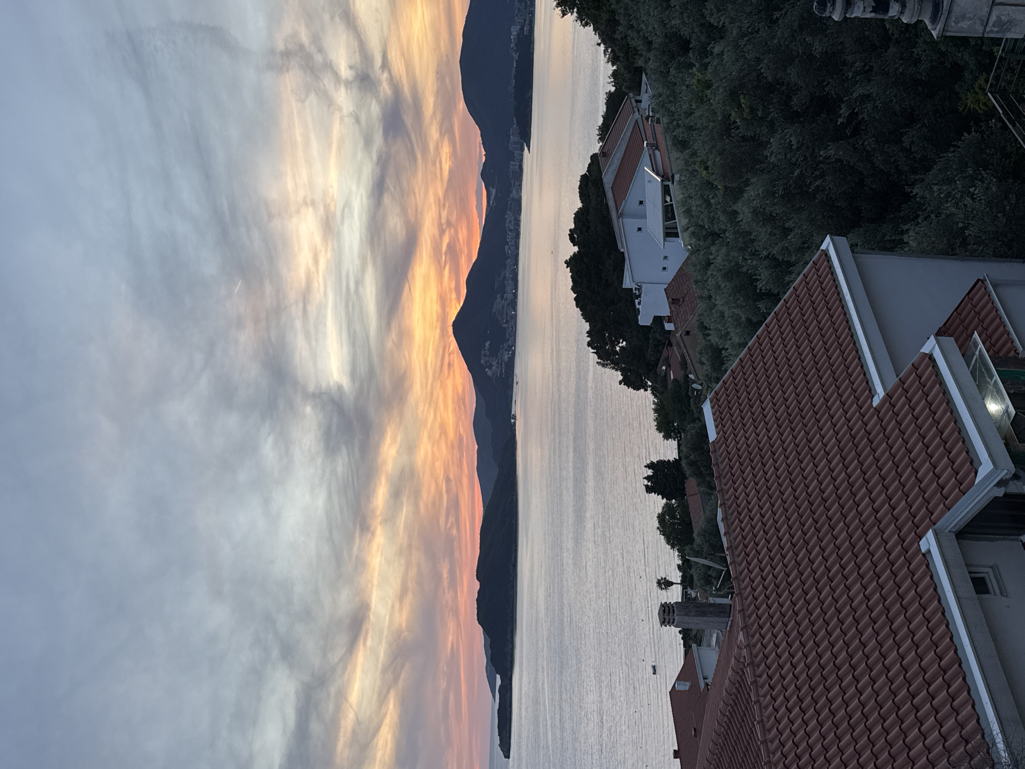 Sunset observed over mountains in Sveti Stefan, Montenegro