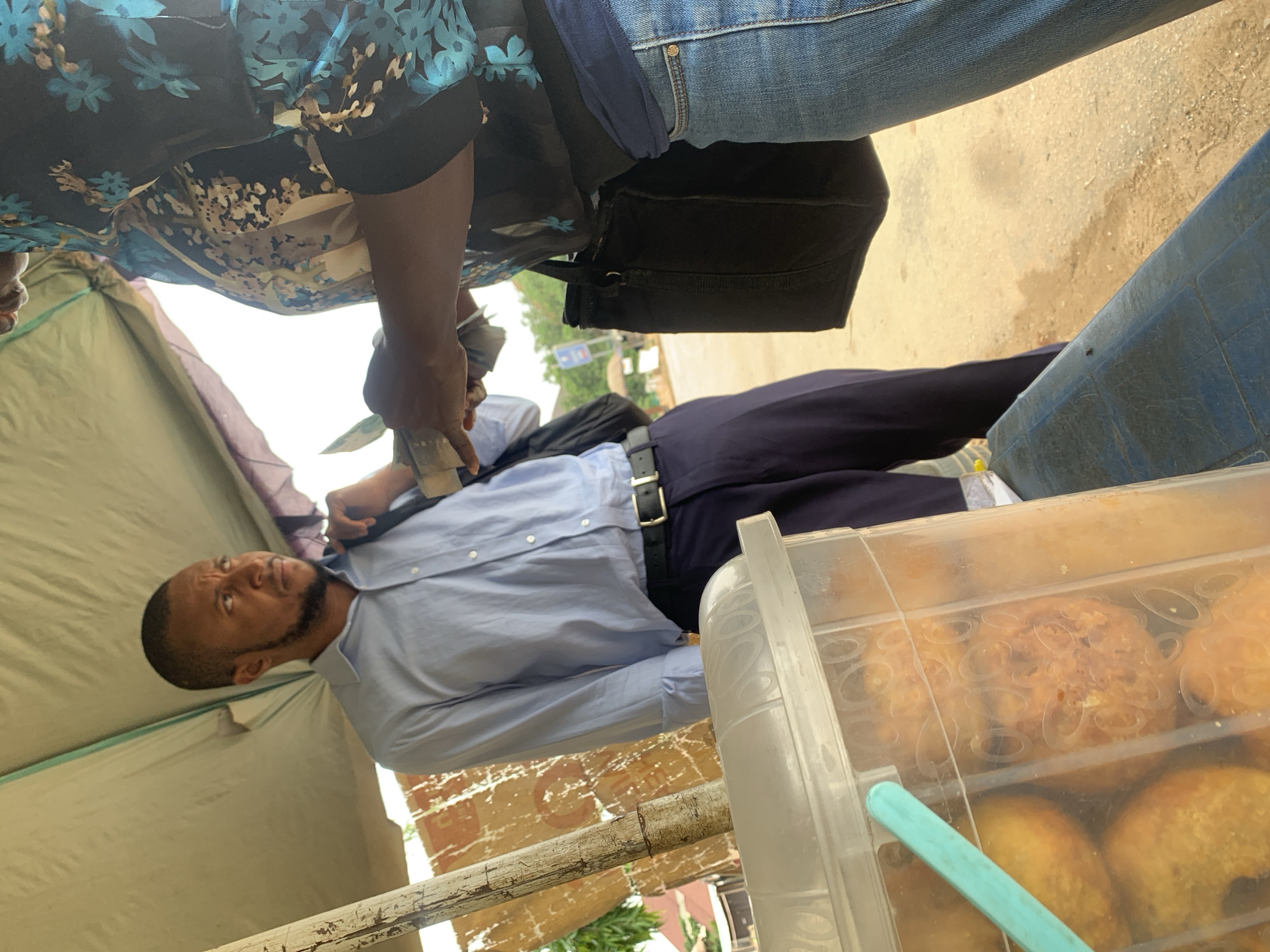 Everyday street life in Abuja on a weekday morning
