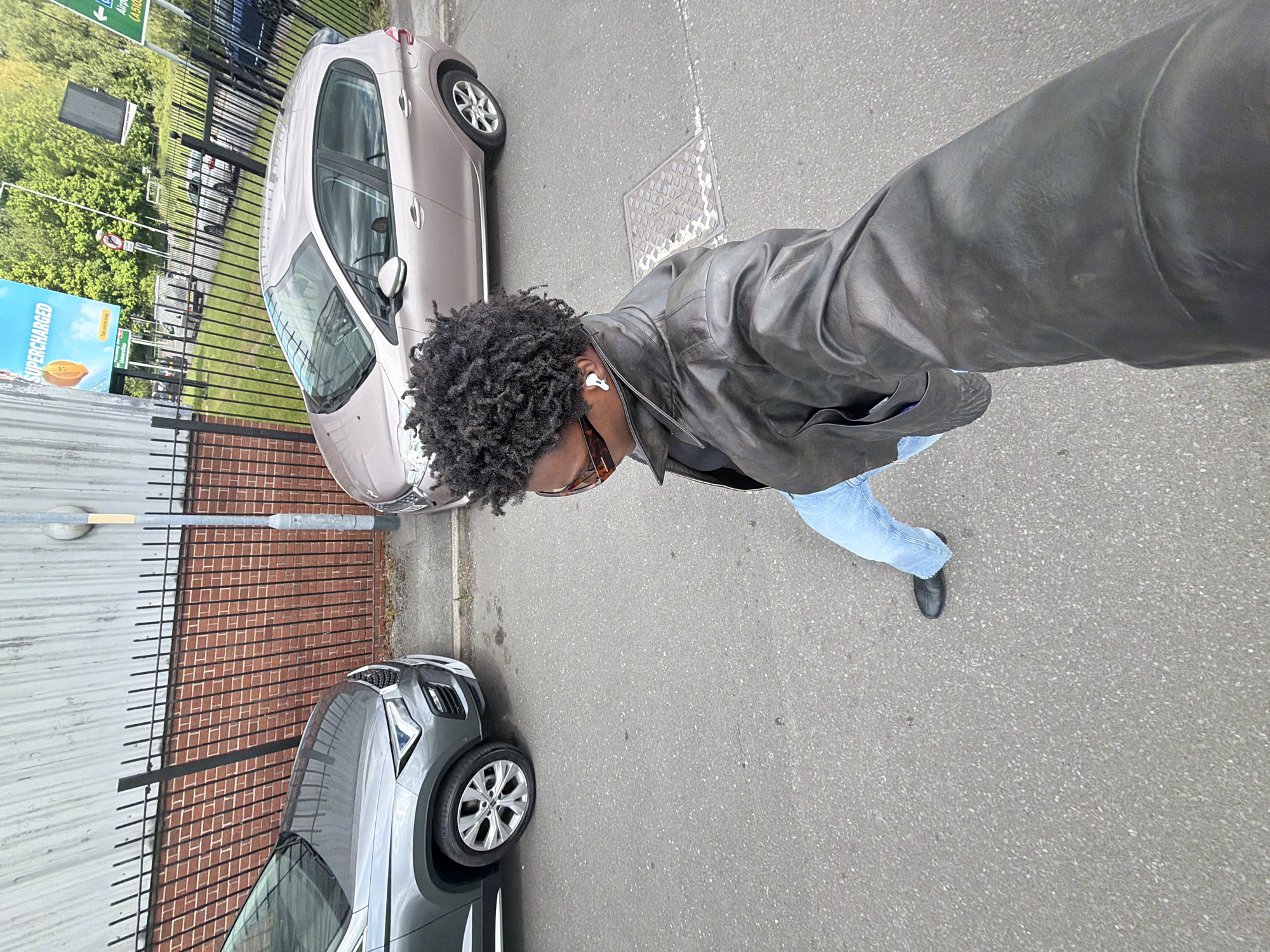 Person observed standing on Manchester street near parked cars