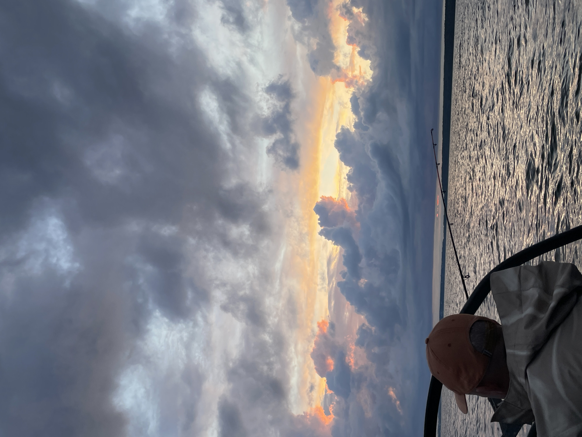 Fishing boat on stormy-sky evening waters near Yablonovka