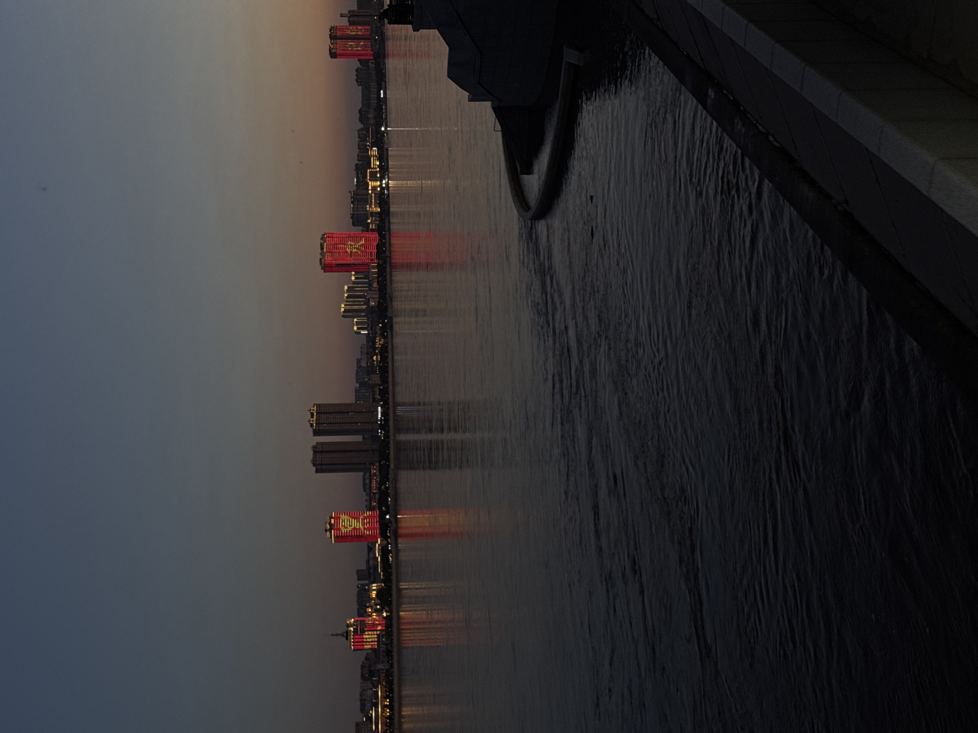 Blagoveshchensk waterfront at dusk, Amur River lighting up