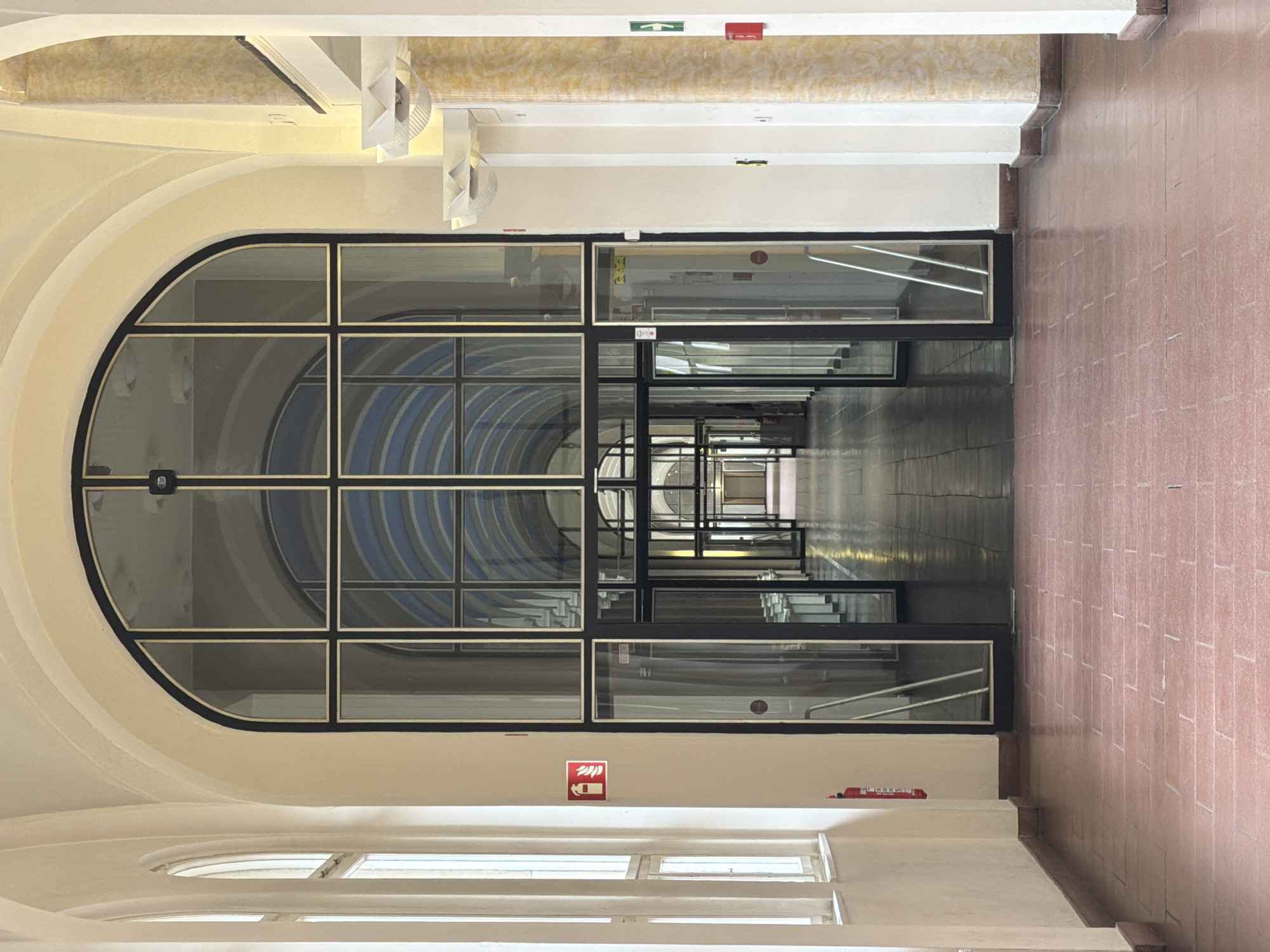 Berlin witness documents arched corridor with glass doorway perspective