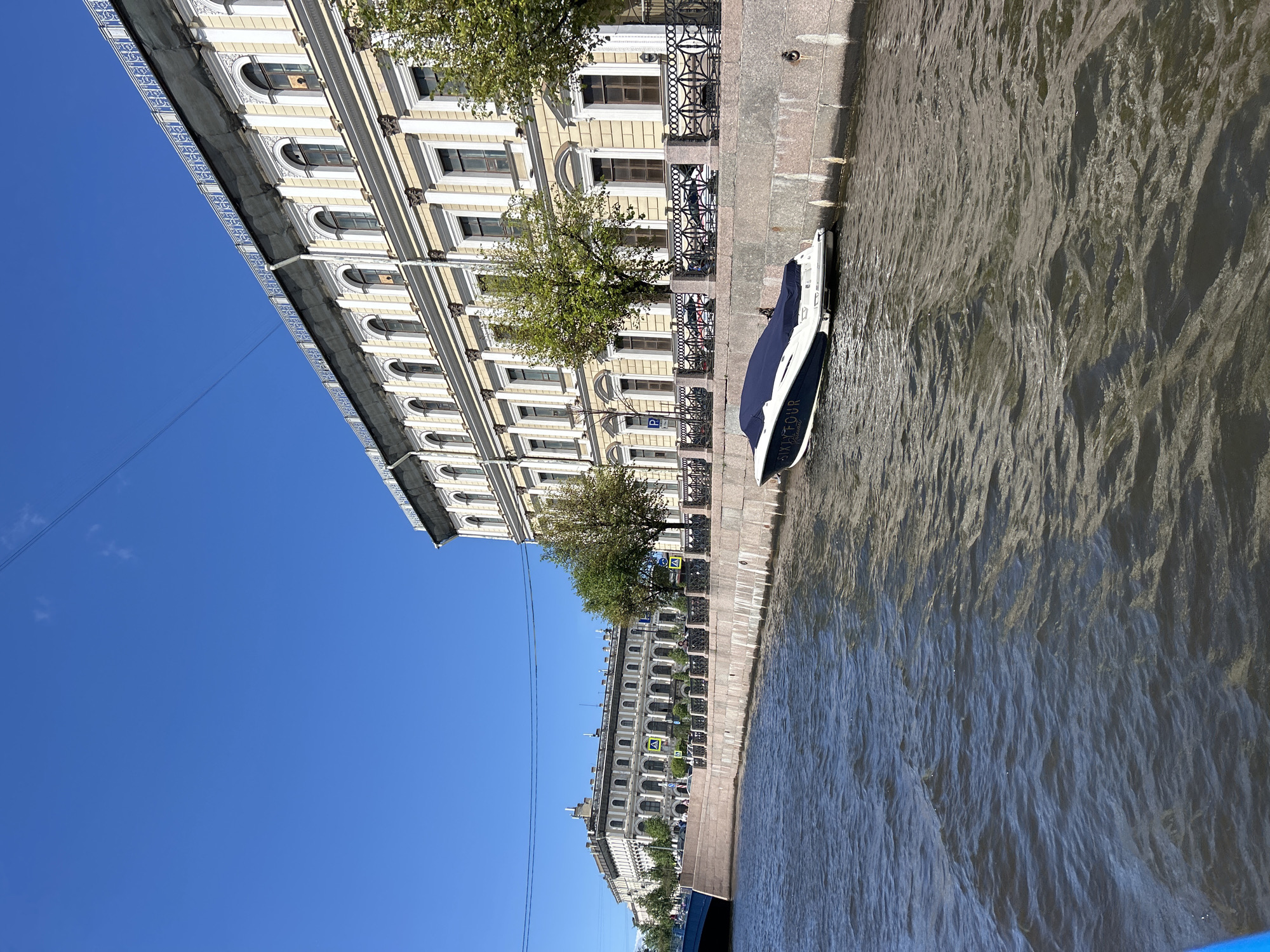 Canal boat tour through St. Petersburg on a clear summer morning
