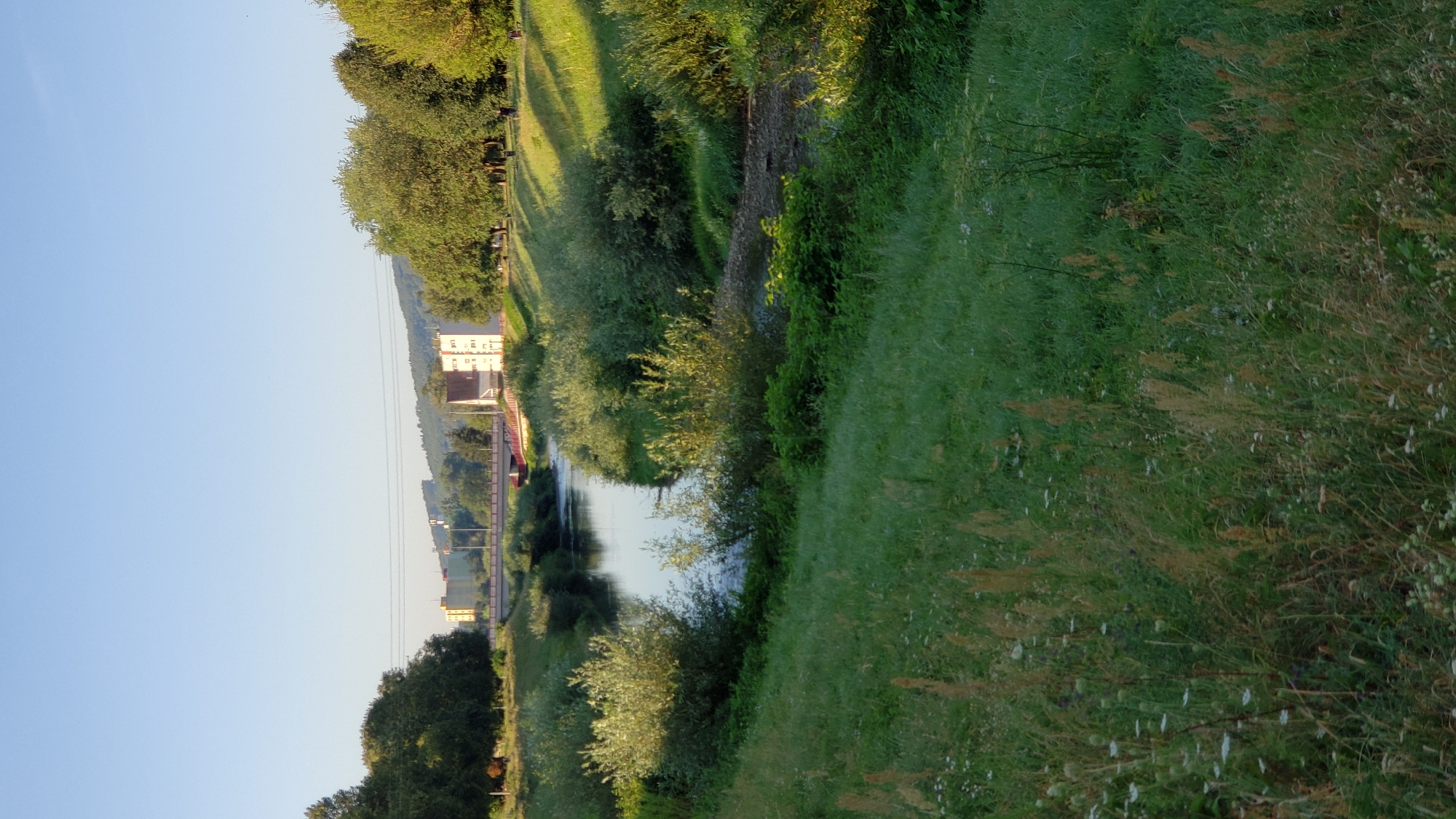 Riverside stroll past a modern church in Prešov, Slovakia