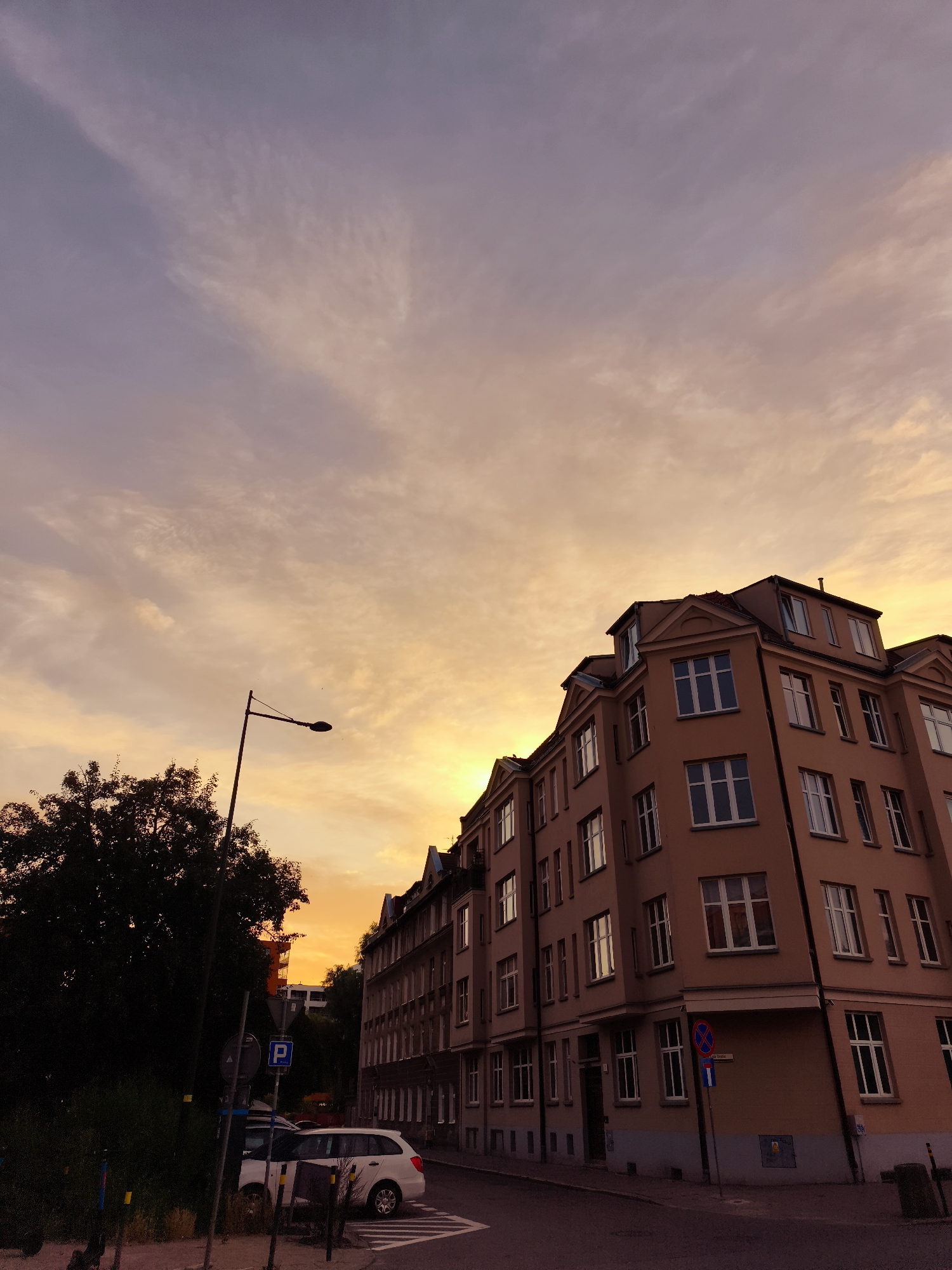 Gdańsk neighborhood at sunset, streets and waterfront