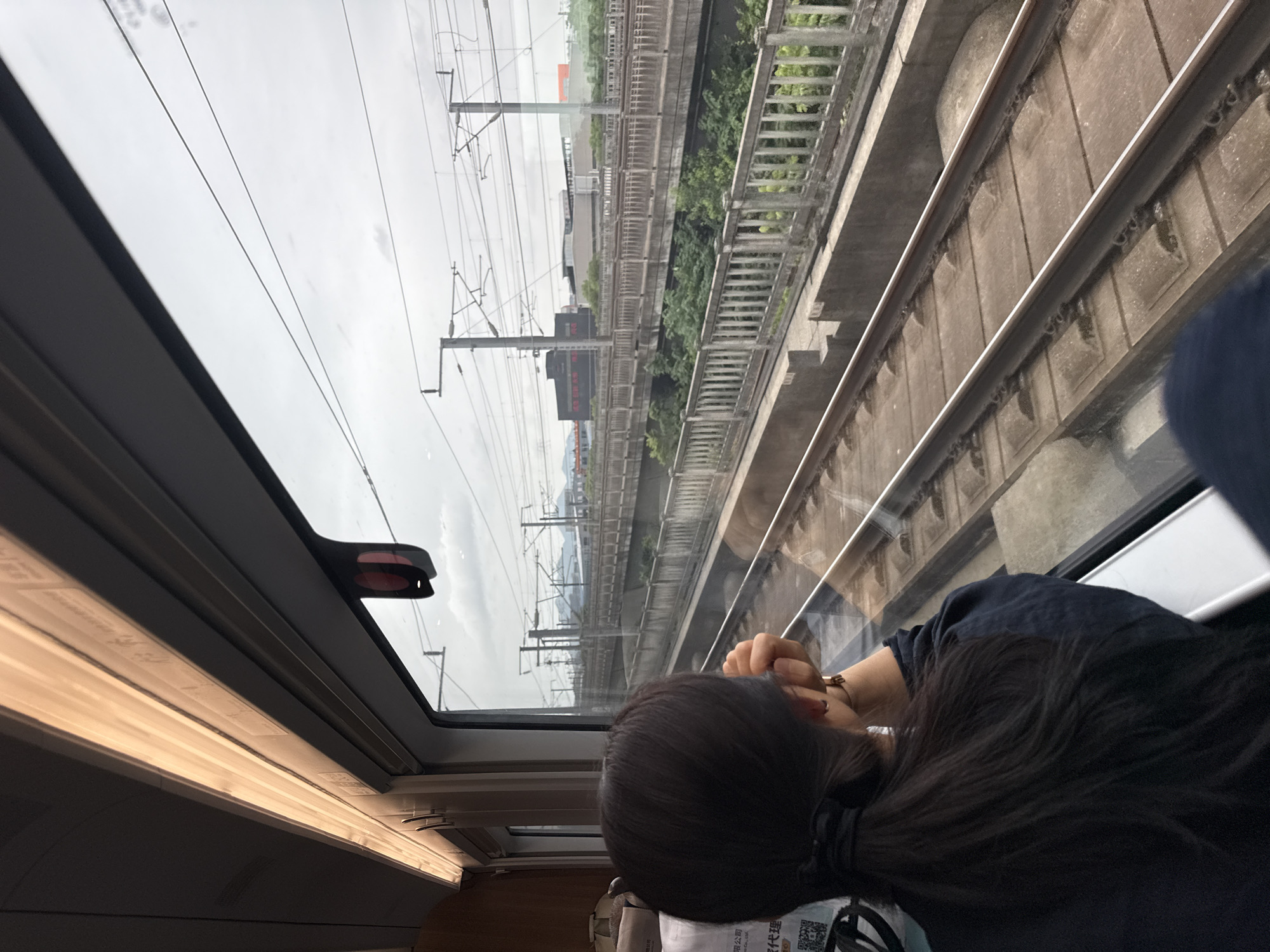 Train window view through Shangcheng District, Hangzhou