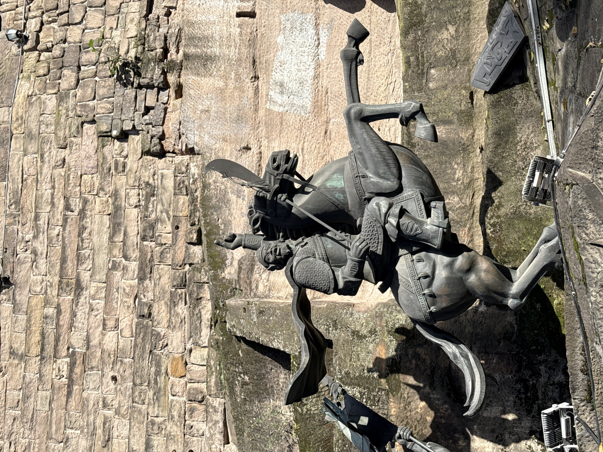 Daily life unfolds around ancient warrior sculptures in Chongqing