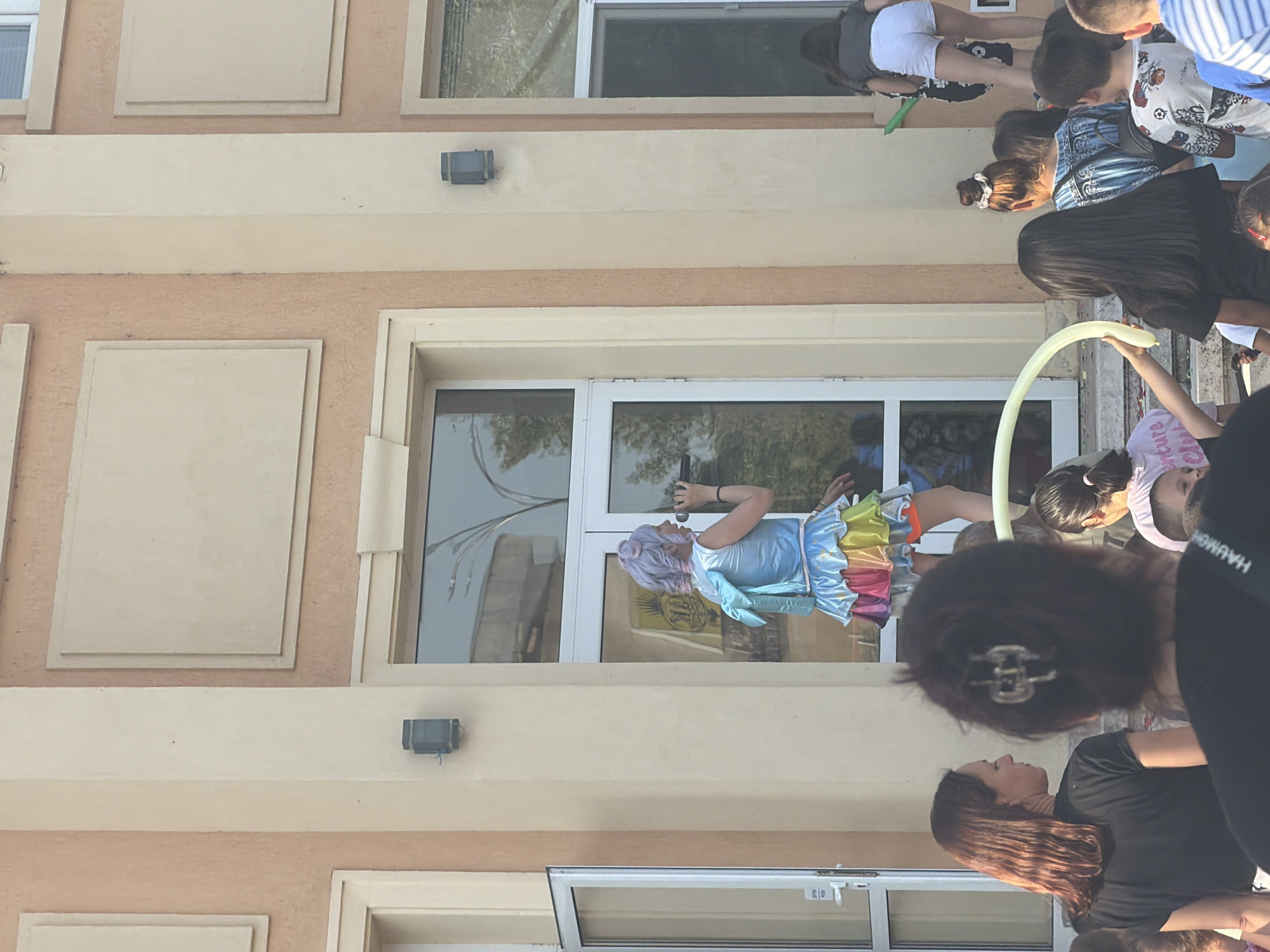 Community gathering with costumed performers outside Bulgarian cultural center