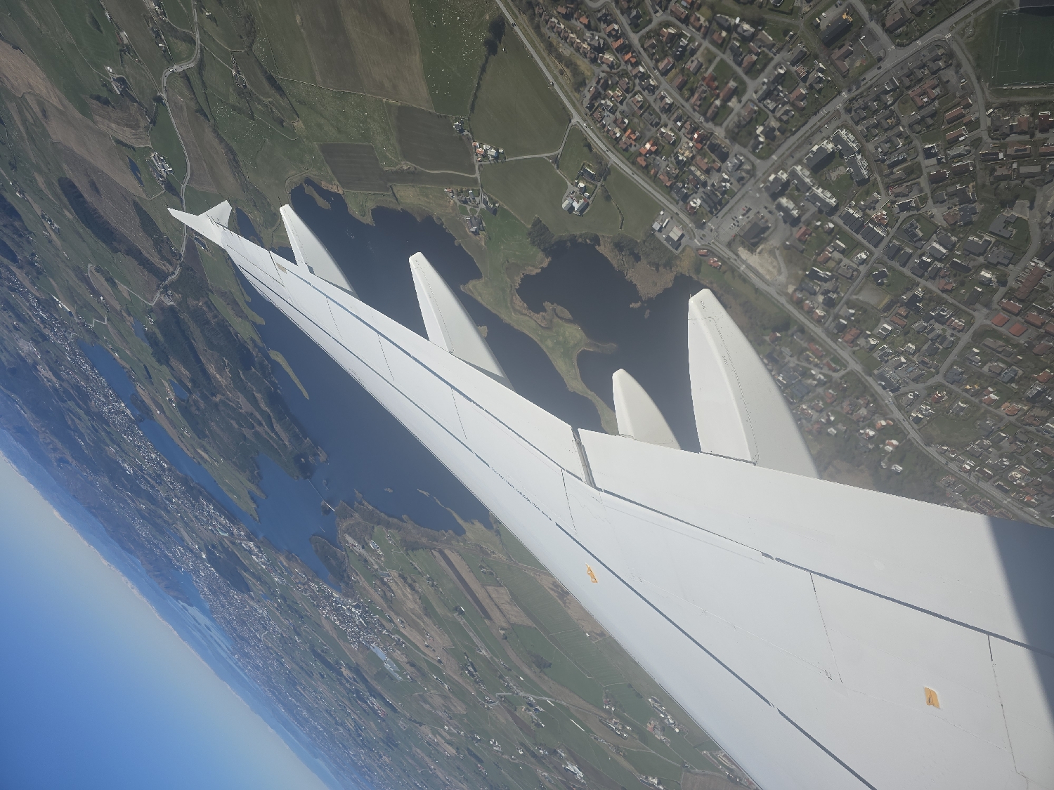 Aerial view captured from airplane window over Bryne, Norway