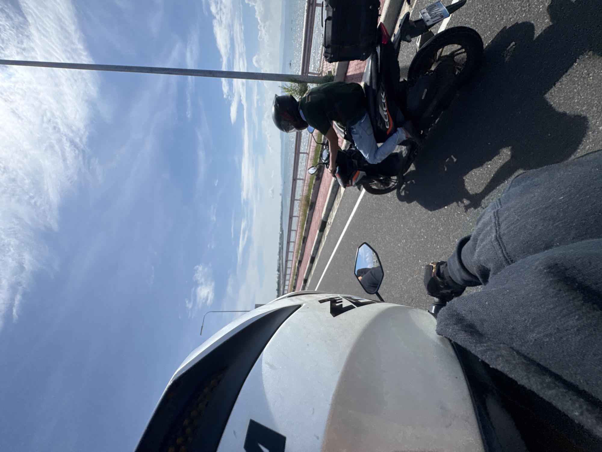 Motorcyclist rides Davao City coastal road in Philippines