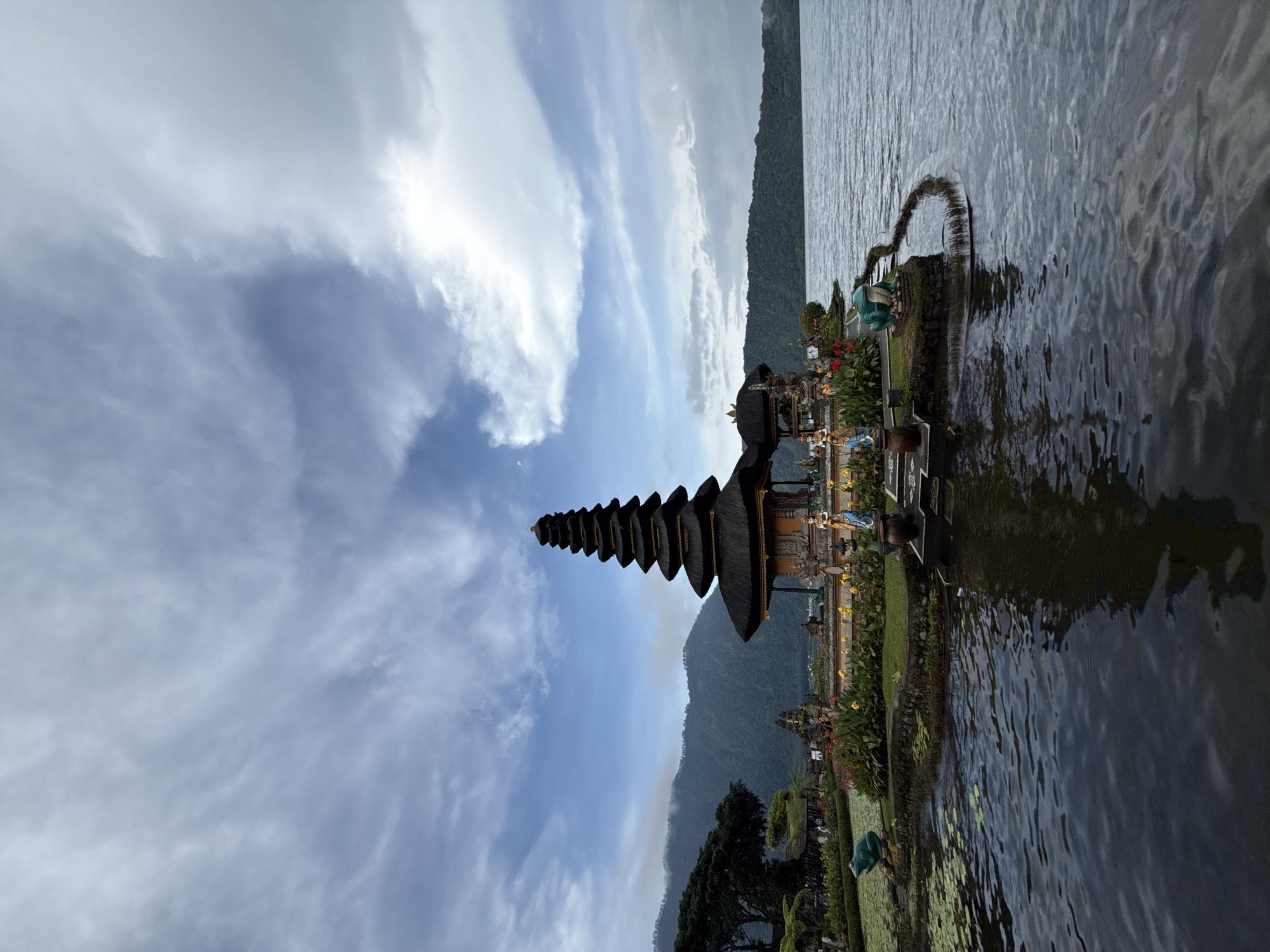 Tourist documents iconic Balinese temple complex at Lake Bratan