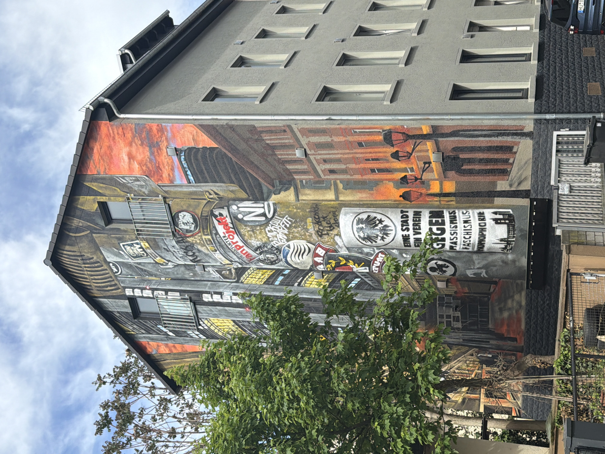 Street scene mural with German graffiti documented in Frankfurt