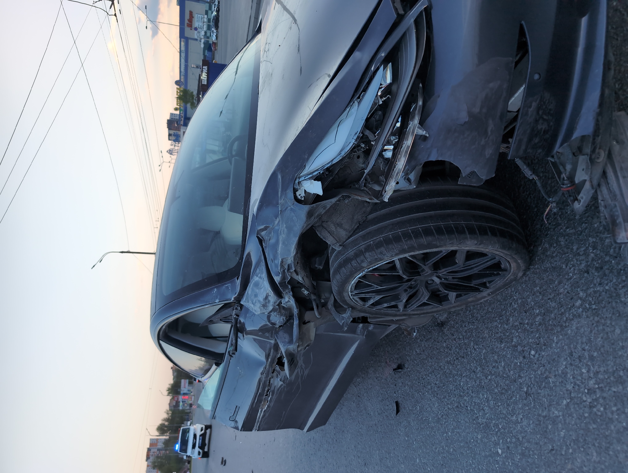 Car accident damages sedan on Izhevsk city street