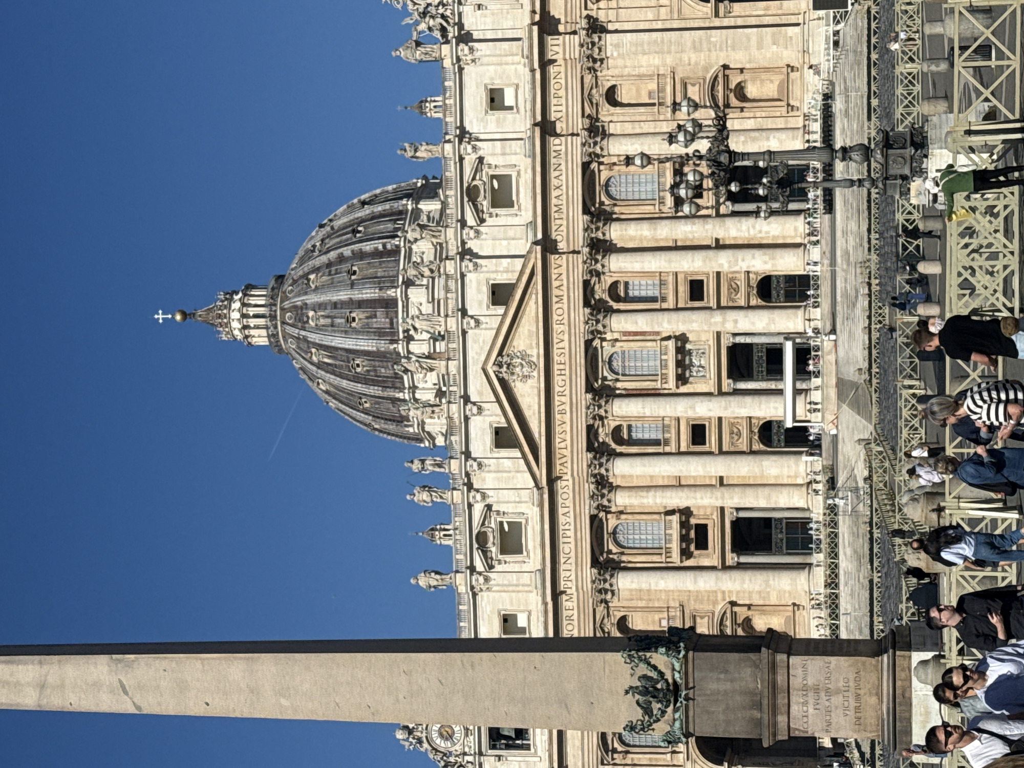 Morning documentation captures sunny St. Peter's Square with tourists