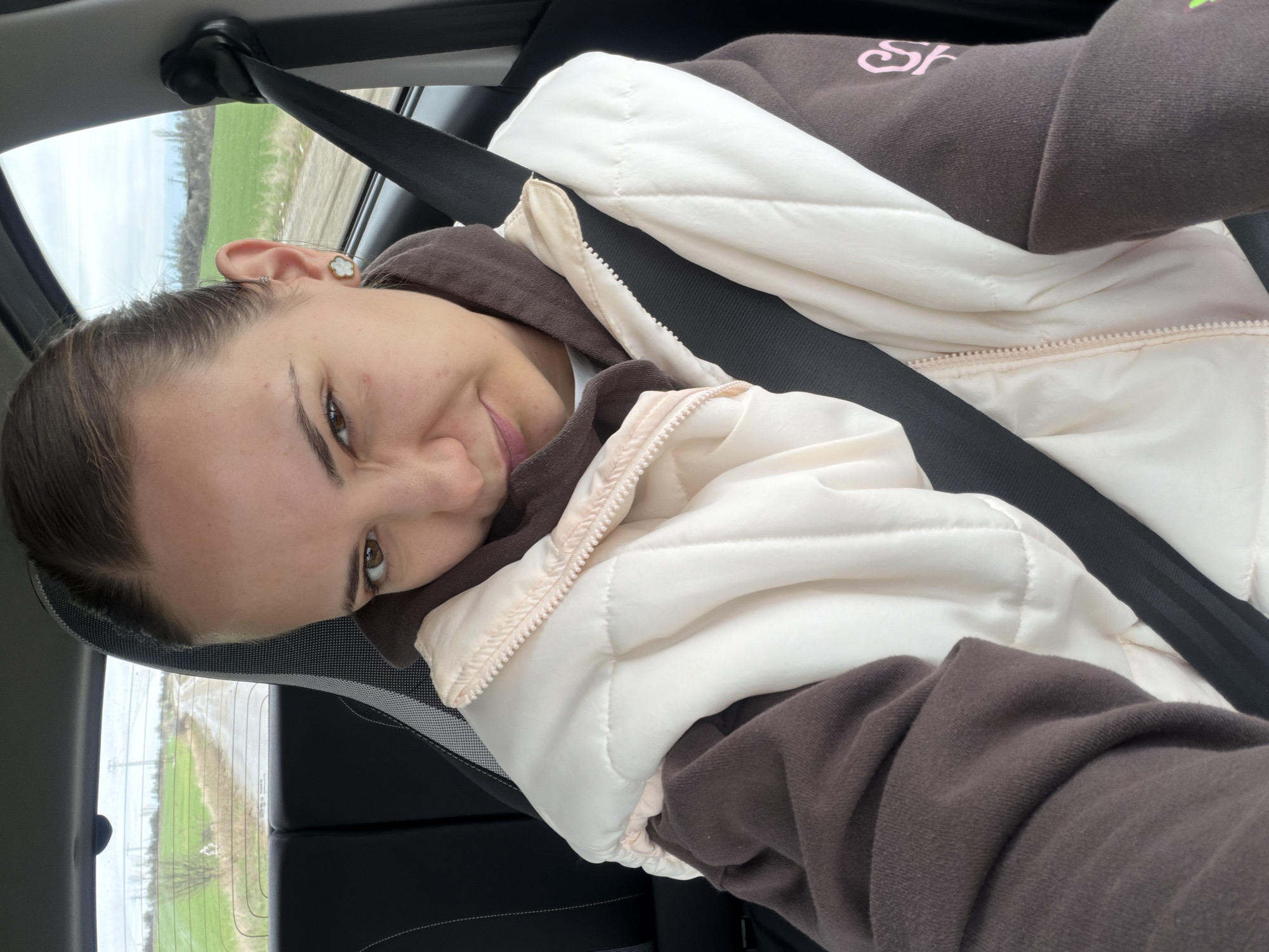 Woman photographed smiling in moving car in Sofia