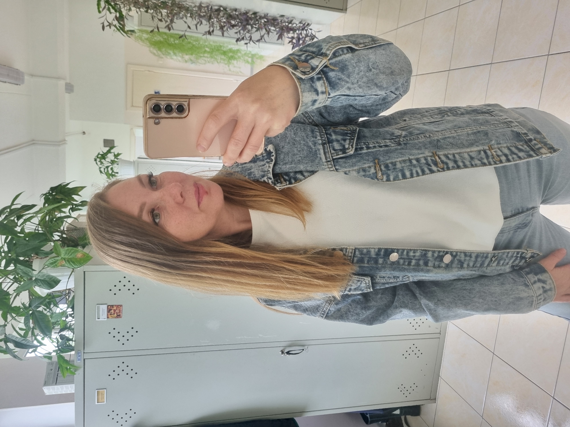 Woman takes mirror selfie in Kemul, Russia