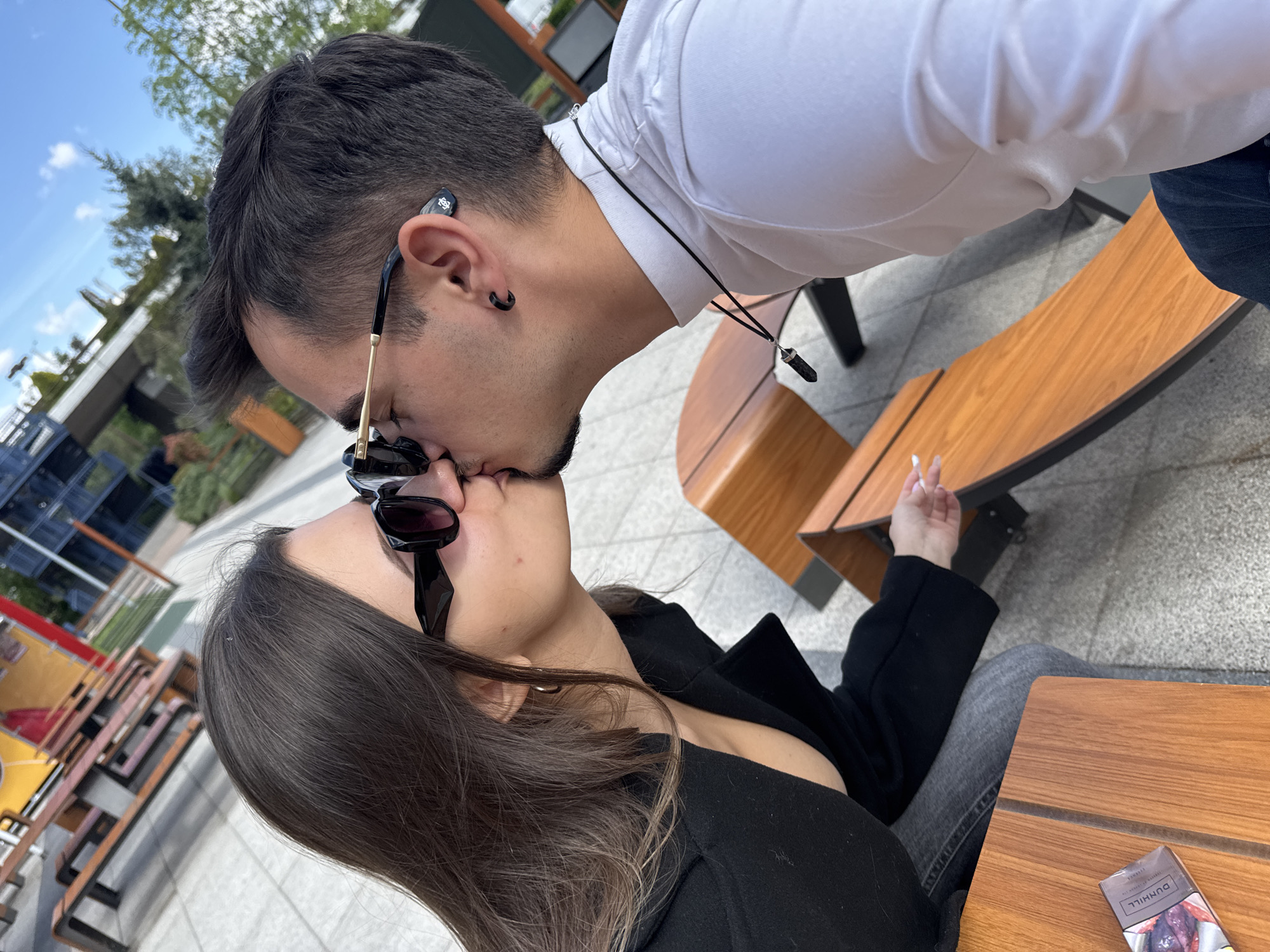Couple shares intimate moment at Sofia McDonald's outdoor seating