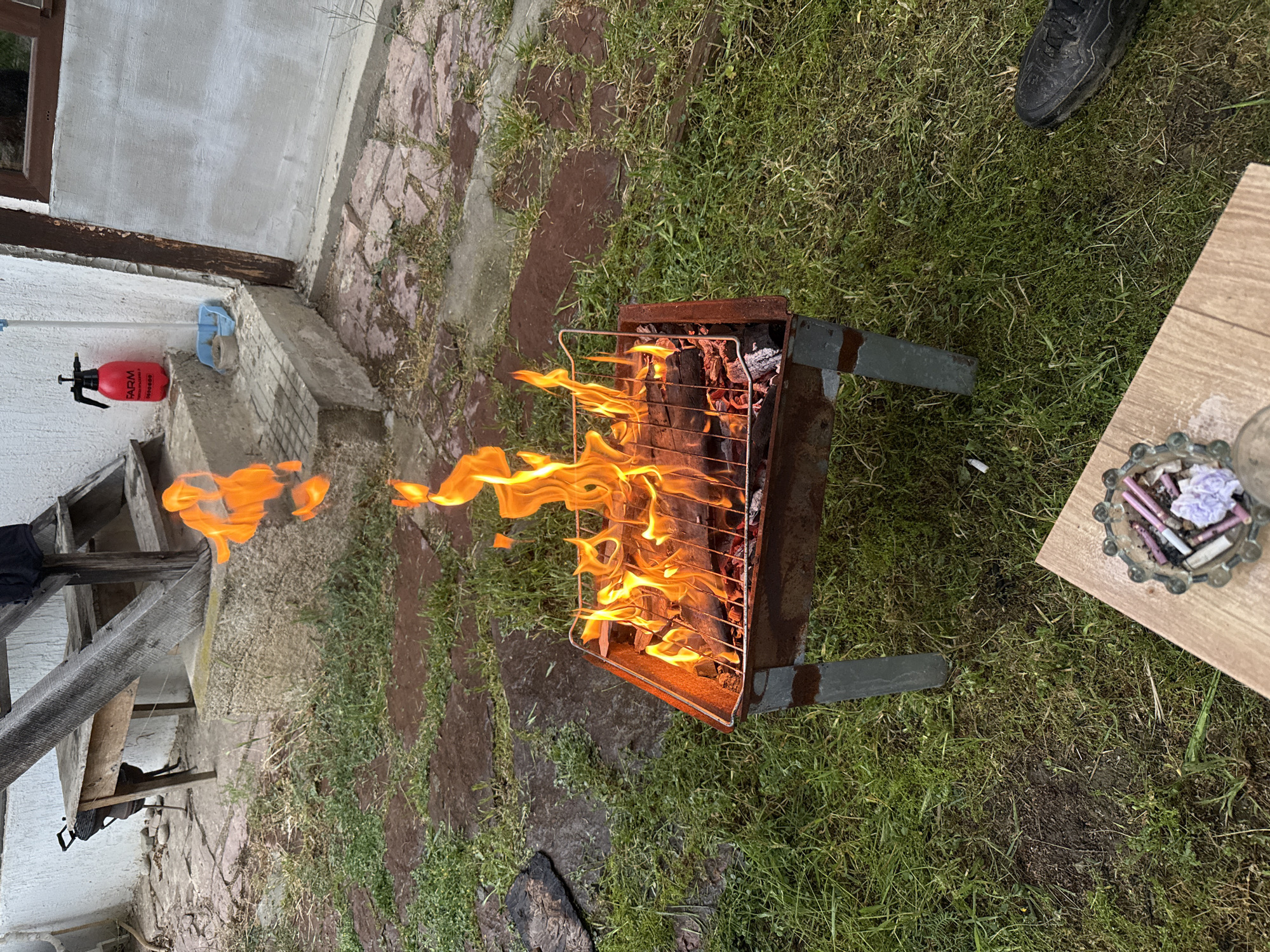 Backyard barbecue grill in use in Banya, Bulgaria