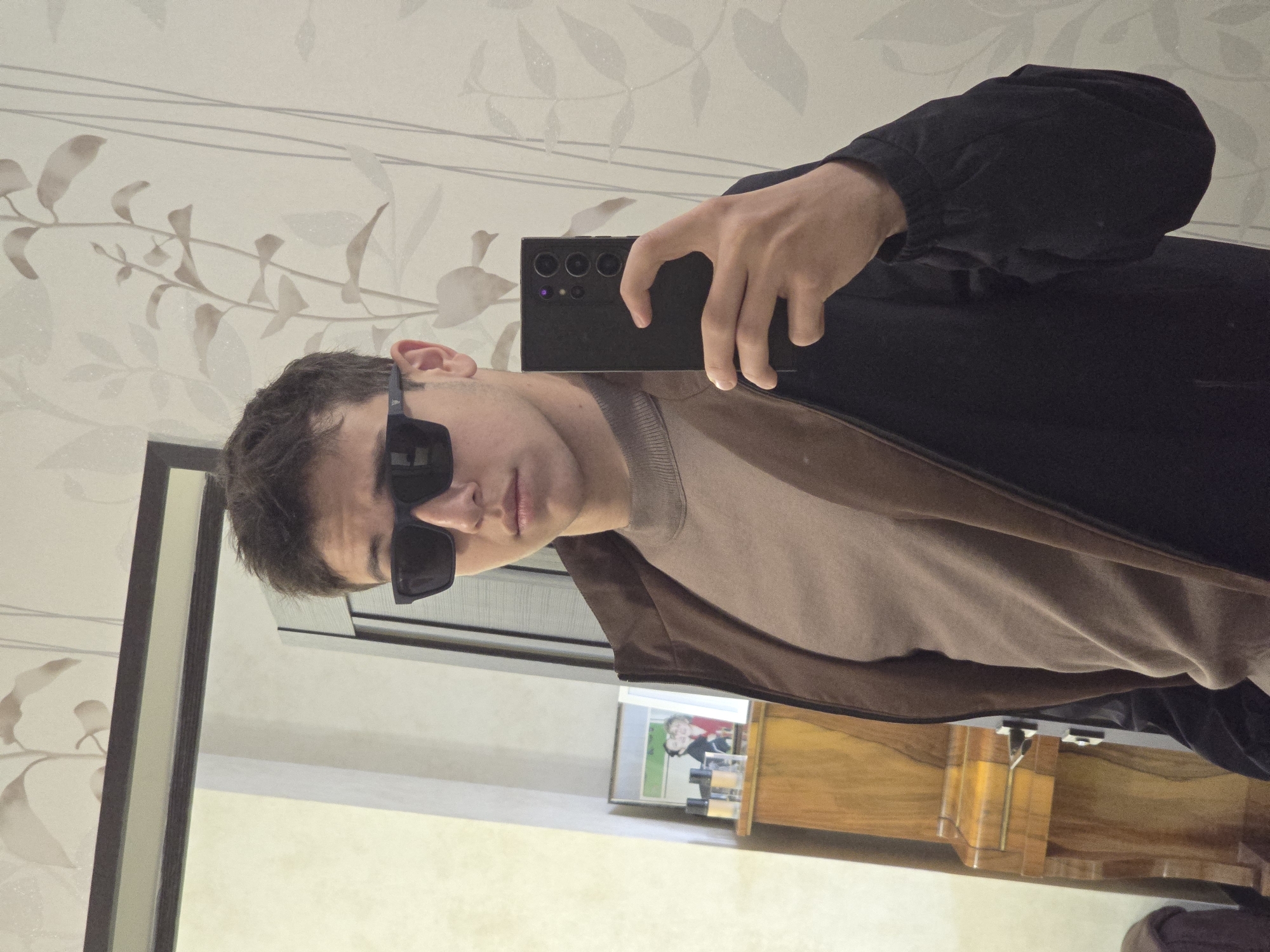 Young man takes selfie indoors in Yerevan, Armenia