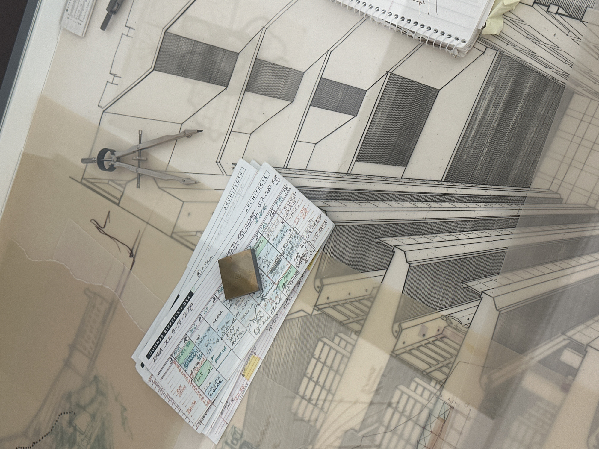 Architect sketches building plans overlooking Riga's historic riverfront