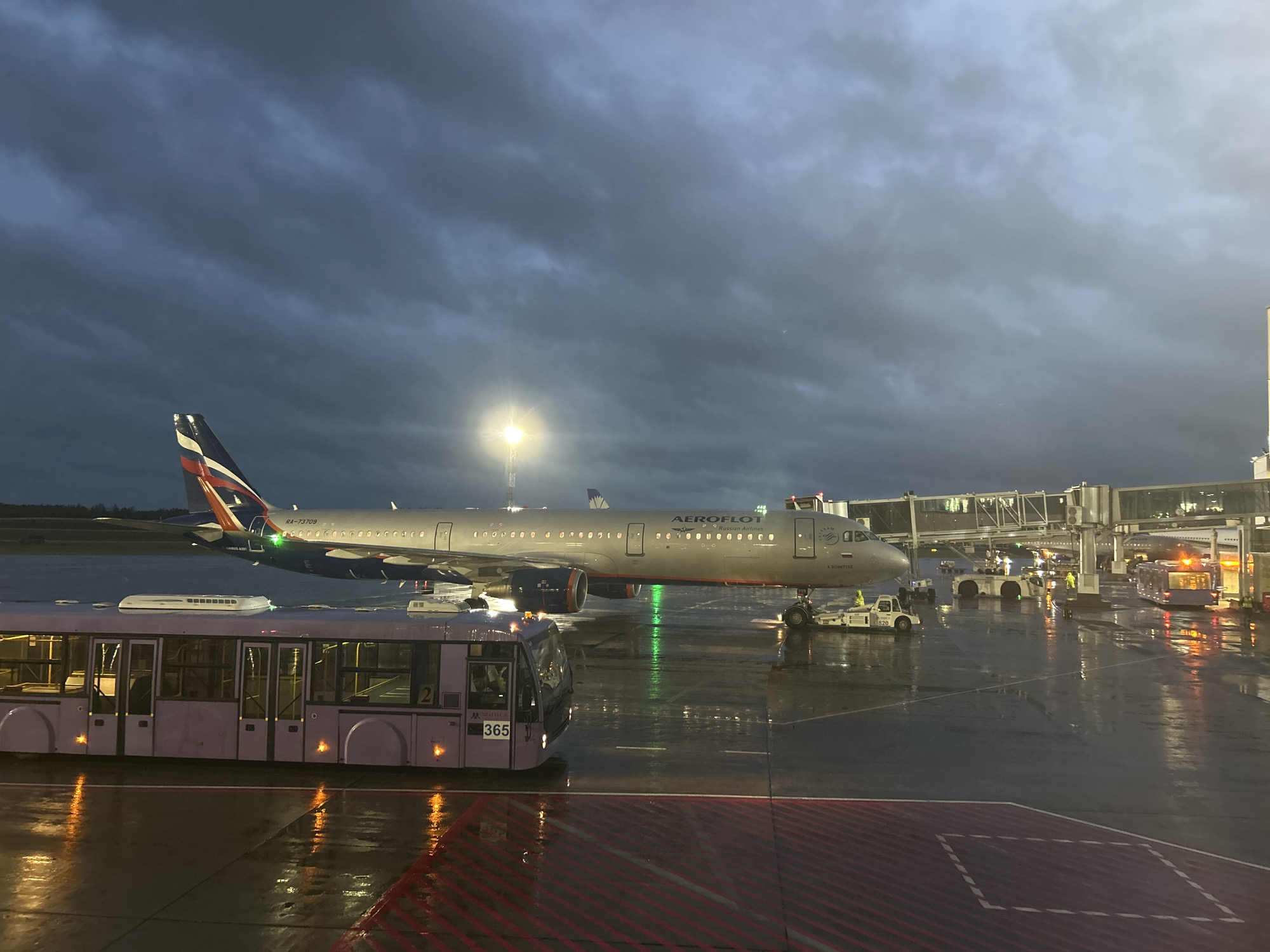 Aeroflot and Belavia aircraft on a rainy evening at Minsk Airport