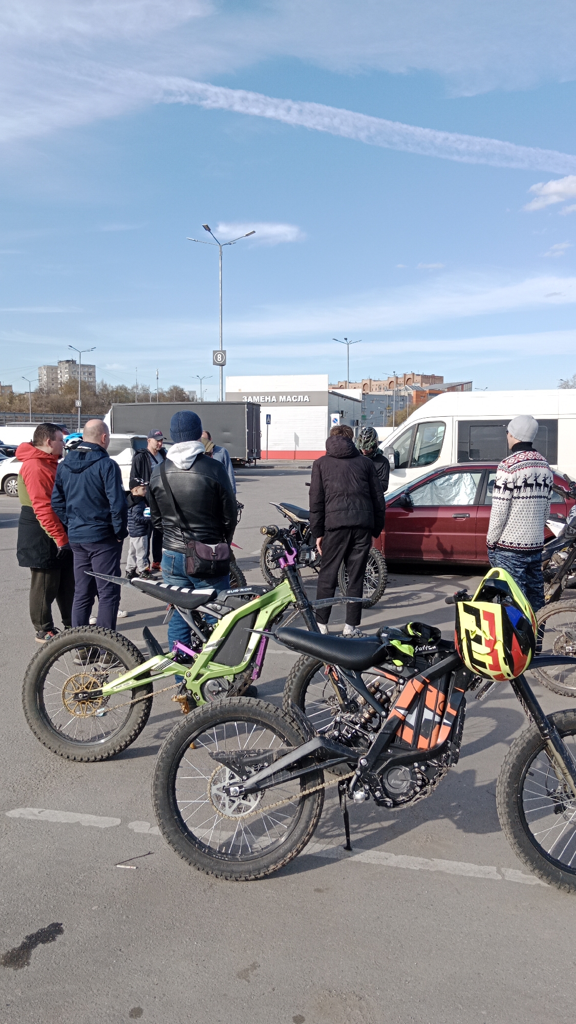 Group gathers with electric motorcycles near Balashikha hypermarket