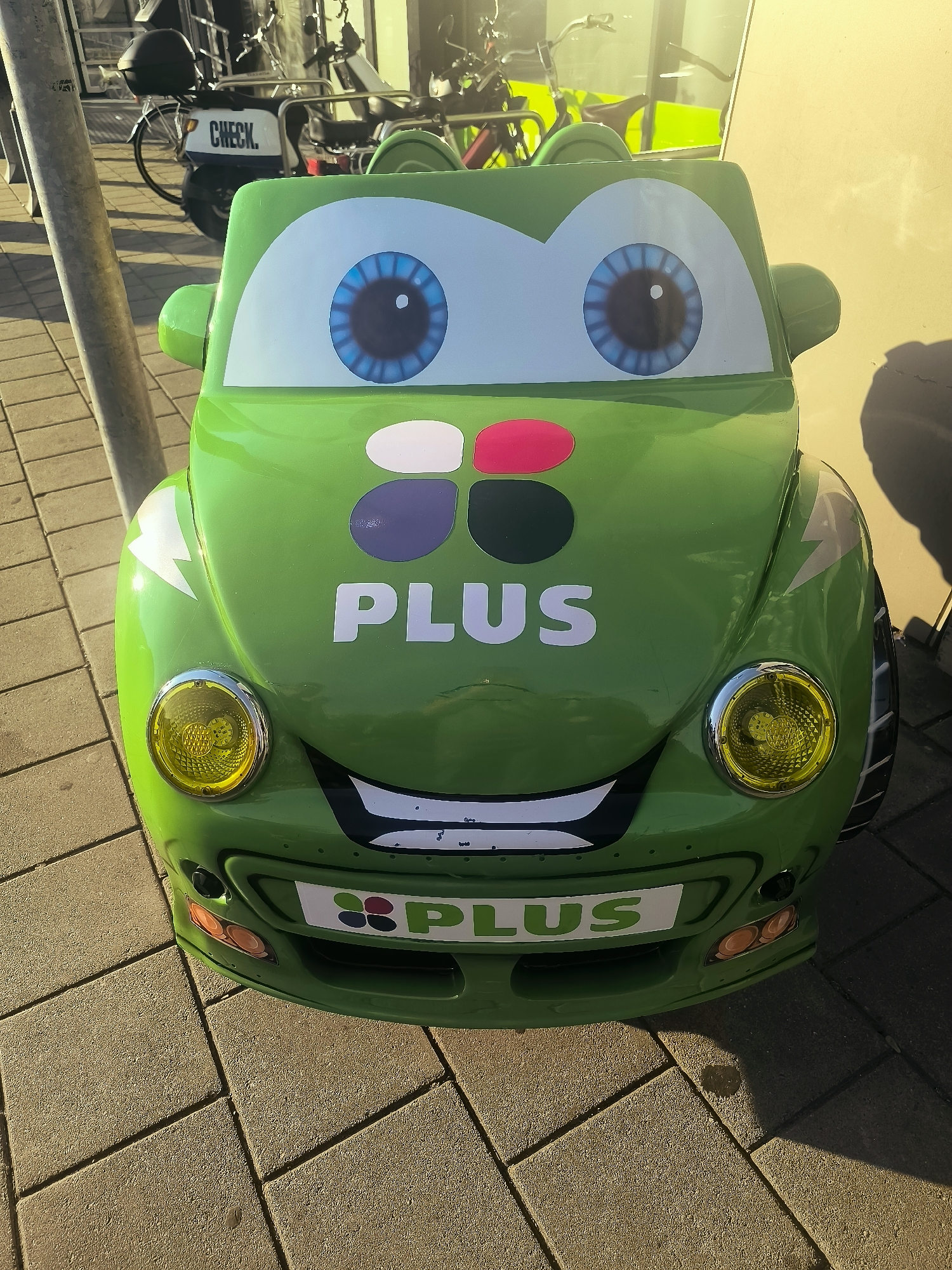 Cartoon ride and supermarket exterior outside Plus De Greef, Almere
